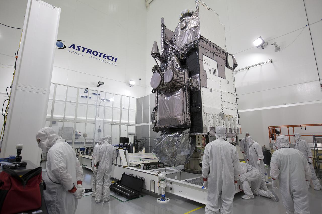 Team members are securing the Geostationary Operational Environmental Satellite (GOES-R) in the vertical position on an “up-ender” inside the Astrotech payload processing facility in Titusville, Florida near NASA’s Kennedy Space Center. GOES-R will be the first satellite in a series of next-generation NOAA GOES Satellites. The spacecraft is to launch aboard a United Launch Alliance Atlas V rocket in November. 
