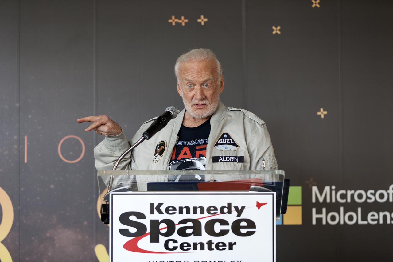 Apollo 11 astronaut Buzz Aldrin speaks to members of the news media during a preview of the new Destination: Mars experience at the Kennedy Space Center Visitor Complex. Destination: Mars gives guests an opportunity to “visit” several sites on Mars using real imagery from NASA’s Curiosity Mars Rover. Based on OnSight, a tool created by NASA’s Jet Propulsion Laboratory in Pasadena, California, the experience brings guests together with a holographic version of Aldrin as they are guided to Mars using Microsoft HoloLens mixed reality headset. Photo credit: NASA/Charles Babir