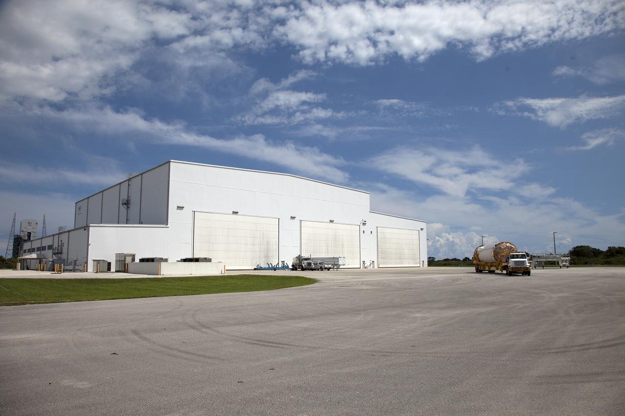 On the same day it arrived, the Atlas V Centaur stage departs the Horizontal Integration Facility on its way to the Atlas Spaceflight Operations Center near Space Launch Complex 41 at Cape Canaveral Air Force Station in Florida. The Geostationary Operational Environmental Satellite (GOES-R) will launch aboard the Atlas V rocket in November. GOES-R will be the first satellite in a series of next-generation NOAA GOES Satellites.