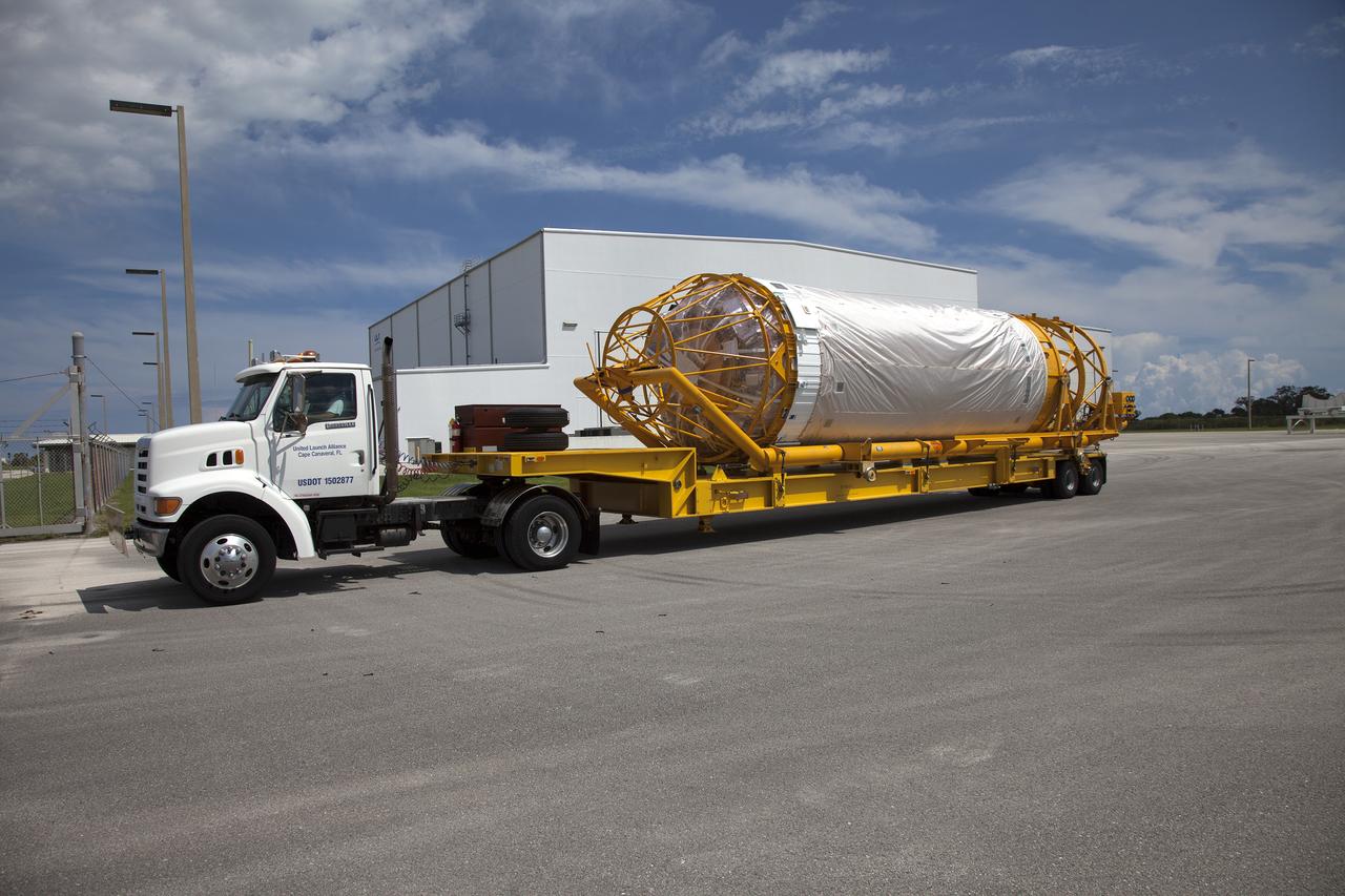 On the same day it arrived, the Atlas V Centaur stage departs the Horizontal Integration Facility on its way to the Atlas Spaceflight Operations Center near Space Launch Complex 41 at Cape Canaveral Air Force Station in Florida. The Geostationary Operational Environmental Satellite (GOES-R) will launch aboard the Atlas V rocket in November. GOES-R will be the first satellite in a series of next-generation NOAA GOES Satellites. 