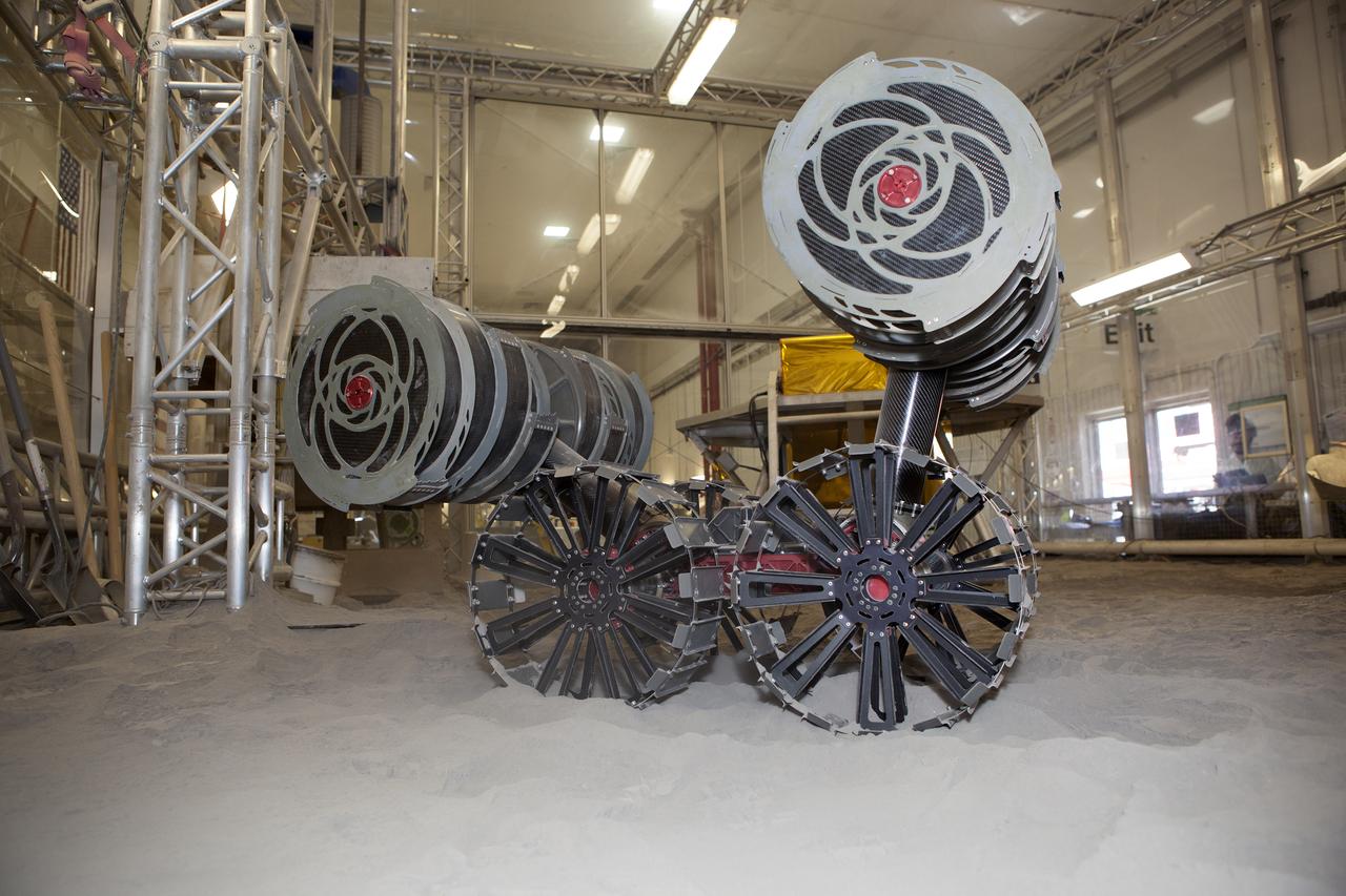 An integrated test of the MARCO POLO/Mars Pathfinder in-situ resource utilization, or ISRU, system takes place at NASA’s Kennedy Space Center in Florida. A mockup of MARCO POLO, an ISRU propellant production technology demonstration simulated mission, is tested in a regolith bin with RASSOR 2.0, the Regolith Advanced Surface Systems Operations Robot.  On the surface of Mars, mining robots like RASSOR will dig down into the regolith and take the material to a processing plant where usable elements such as hydrogen, oxygen and water can be extracted for life support systems. Regolith also shows promise for both construction and creating elements for rocket fuel.