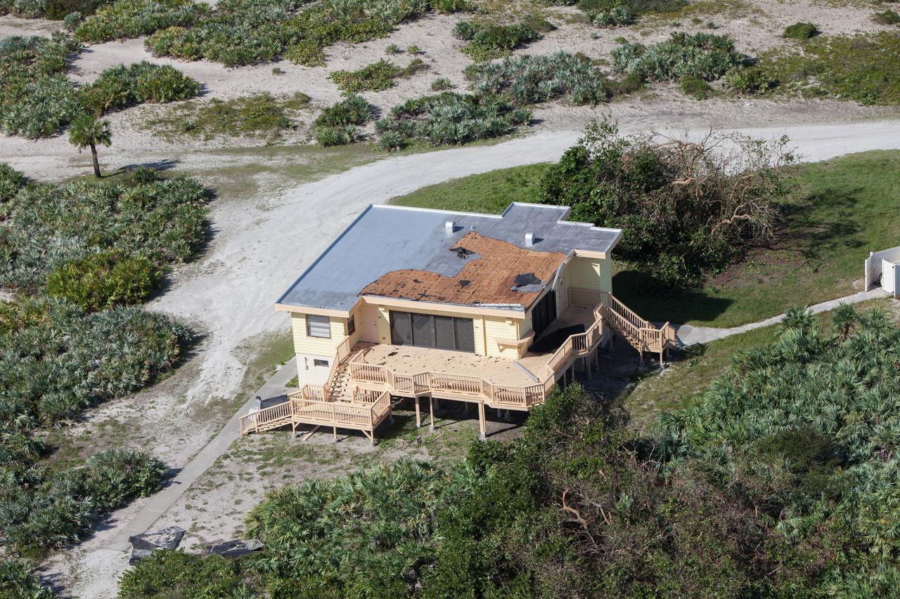 The Beach House is seen during an aerial survey of NASA's Kennedy Space Center in Florida on Saturday. The survey was performed to identify structures and facilities that may have sustained damage from Hurricane Matthew as the storm passed to the east of Kennedy on Oct. 6 and 7, 2016. Officials determined that the center received some isolated roof damage, damaged support buildings, a few downed power lines, and limited water intrusion. Beach erosion also occurred, although the storm surge was less than expected. NASA closed the center ahead of the storm’s onset and only a small team of specialists known as the Rideout Team was on the center as the storm approached and passed