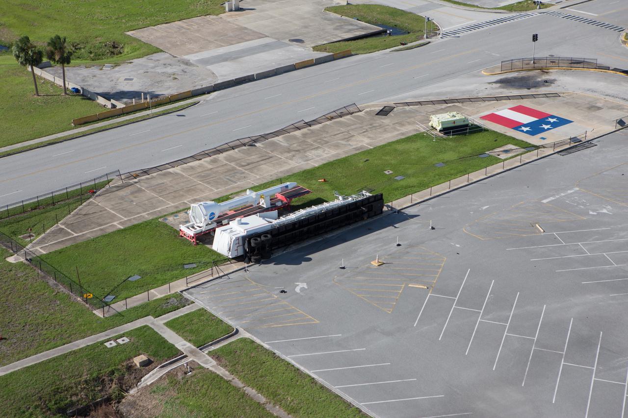 A display area in front of the Vehicle Assembly Building is seen during an aerial survey of NASA's Kennedy Space Center in Florida on Saturday. The survey was performed to identify structures and facilities that may have sustained damage from Hurricane Matthew as the storm passed to the east of Kennedy on Oct. 6 and 7, 2016. Officials determined that the center received some isolated roof damage, damaged support buildings, a few downed power lines, and limited water intrusion. Beach erosion also occurred, although the storm surge was less than expected. NASA closed the center ahead of the storm’s onset and only a small team of specialists known as the Rideout Team was on the center as the storm approached and passed.