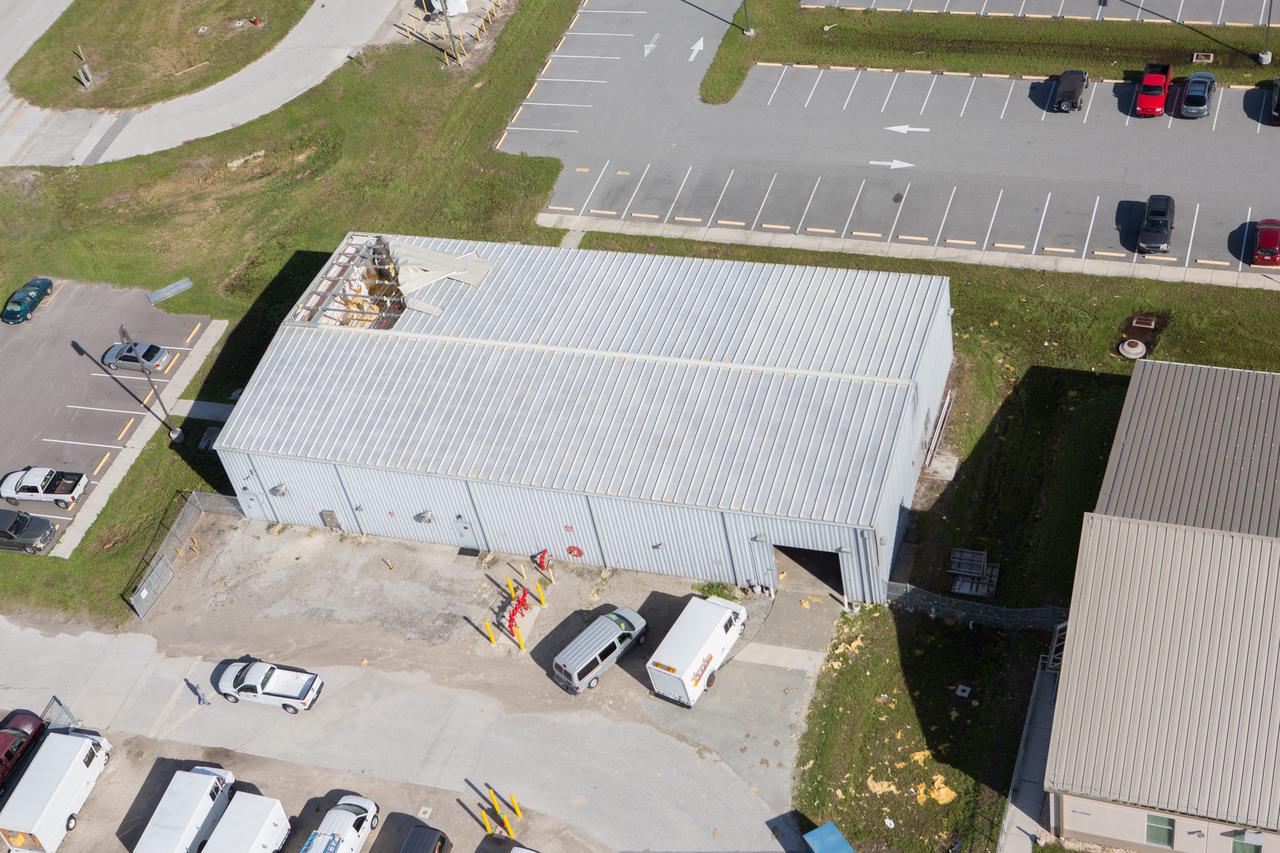 A support building is seen during an aerial survey of NASA's Kennedy Space Center in Florida on Saturday. The survey was performed to identify structures and facilities that may have sustained damage from Hurricane Matthew as the storm passed to the east of Kennedy on Oct. 6 and 7, 2016. Officials determined that the center received some isolated roof damage, damaged support buildings, a few downed power lines, and limited water intrusion. Beach erosion also occurred, although the storm surge was less than expected. NASA closed the center ahead of the storm’s onset and only a small team of specialists known as the Rideout Team was on the center as the storm approached and passed. 