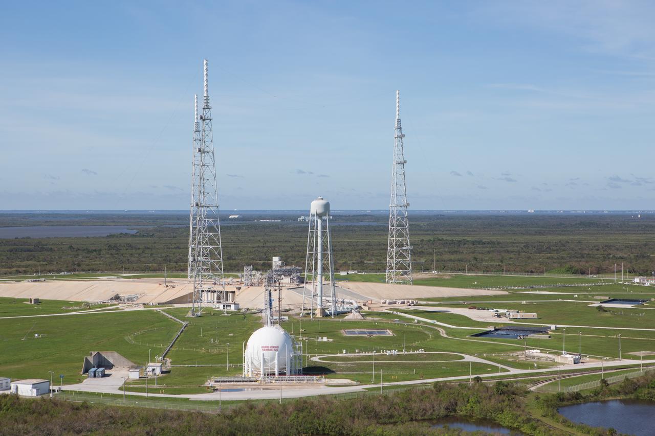 Launch Complex 39B is seen during an aerial survey of NASA's Kennedy Space Center in Florida on Saturday. The survey was performed to identify structures and facilities that may have sustained damage from Hurricane Matthew as the storm passed to the east of Kennedy on Oct. 6 and 7, 2016. Officials determined that the center received some isolated roof damage, damaged support buildings, a few downed power lines, and limited water intrusion. Beach erosion also occurred, although the storm surge was less than expected. NASA closed the center ahead of the storm’s onset and only a small team of specialists known as the Rideout Team was on the center as the storm approached and passed