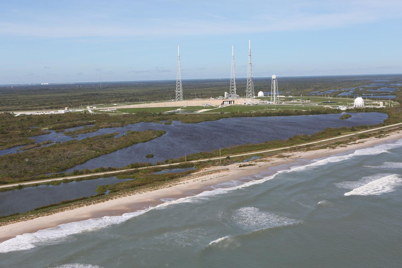 Launch Complex 39B is seen during an aerial survey of NASA's Kennedy Space Center in Florida on Saturday. The survey was performed to identify structures and facilities that may have sustained damage from Hurricane Matthew as the storm passed to the east of Kennedy on Oct. 6 and 7, 2016. Officials determined that the center received some isolated roof damage, damaged support buildings, a few downed power lines, and limited water intrusion. Beach erosion also occurred, although the storm surge was less than expected. NASA closed the center ahead of the storm’s onset and only a small team of specialists known as the Rideout Team was on the center as the storm approached and passed.