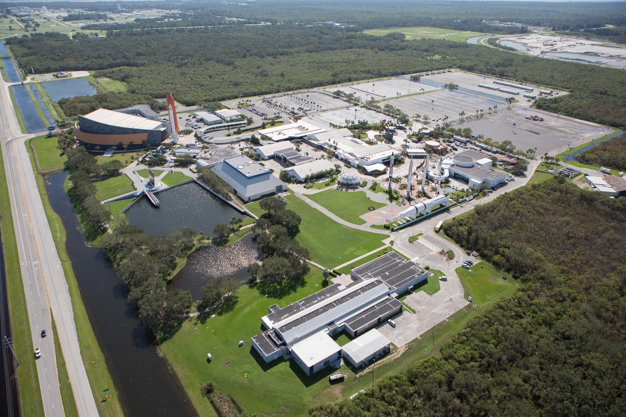 The Kennedy Space Center Visitor Complex is seen during an aerial survey of NASA's Kennedy Space Center in Florida on Saturday. The survey was performed to identify structures and facilities that may have sustained damage from Hurricane Matthew as the storm passed to the east of Kennedy on Oct. 6 and 7, 2016. Officials determined that the center received some isolated roof damage, damaged support buildings, a few downed power lines, and limited water intrusion. Beach erosion also occurred, although the storm surge was less than expected. NASA closed the center ahead of the storm’s onset and only a small team of specialists known as the Rideout Team was on the center as the storm approached and passed.