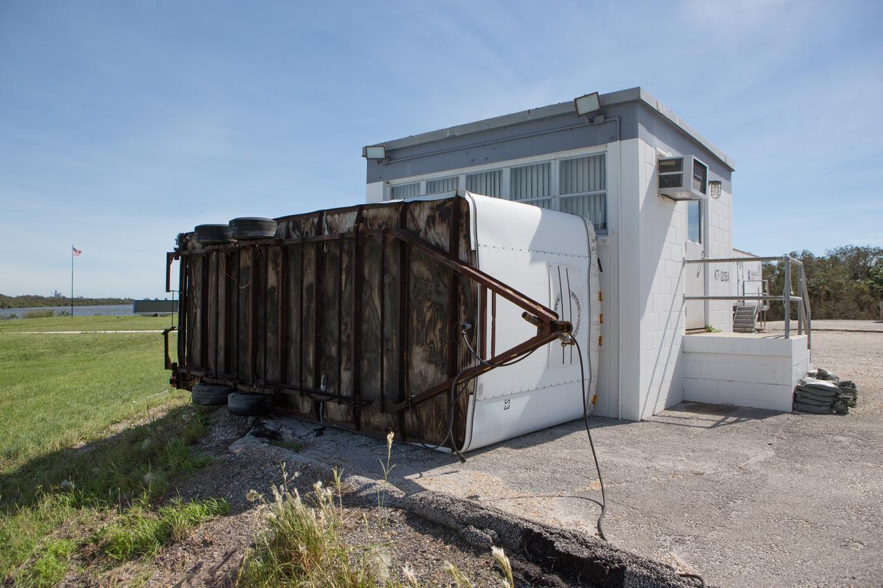 The NASA News Center is seen during an aerial survey of NASA's Kennedy Space Center in Florida on Saturday. The survey was performed to identify structures and facilities that may have sustained damage from Hurricane Matthew as the storm passed to the east of Kennedy on Oct. 6 and 7, 2016. Officials determined that the center received some isolated roof damage, damaged support buildings, a few downed power lines, and limited water intrusion. Beach erosion also occurred, although the storm surge was less than expected. NASA closed the center ahead of the storm’s onset and only a small team of specialists known as the Rideout Team was on the center as the storm approached and passed