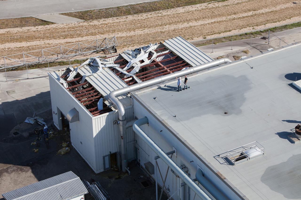 A support building is seen during an aerial survey of NASA's Kennedy Space Center in Florida on Saturday. The survey was performed to identify structures and facilities that may have sustained damage from Hurricane Matthew as the storm passed to the east of Kennedy on Oct. 6 and 7, 2016. Officials determined that the center received some isolated roof damage, damaged support buildings, a few downed power lines, and limited water intrusion. Beach erosion also occurred, although the storm surge was less than expected. NASA closed the center ahead of the storm’s onset and only a small team of specialists known as the Rideout Team was on the center as the storm approached and passed.