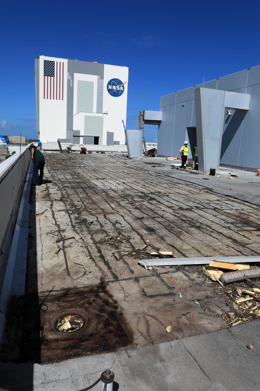 Members of the Disaster Assessment and Recovery Team (DART) repair a section of roof atop the Operations Support Building II at NASA’s Kennedy Space Center in Florida.  The effort is part of the spaceport’s ongoing recovery from Hurricane Matthew, which passed to the east of Kennedy on Oct. 6 and 7, 2016. The center received some isolated roof damage, damaged support buildings, a few downed power lines, and limited water intrusion. Beach erosion also occurred, although the storm surge was less than expected.
