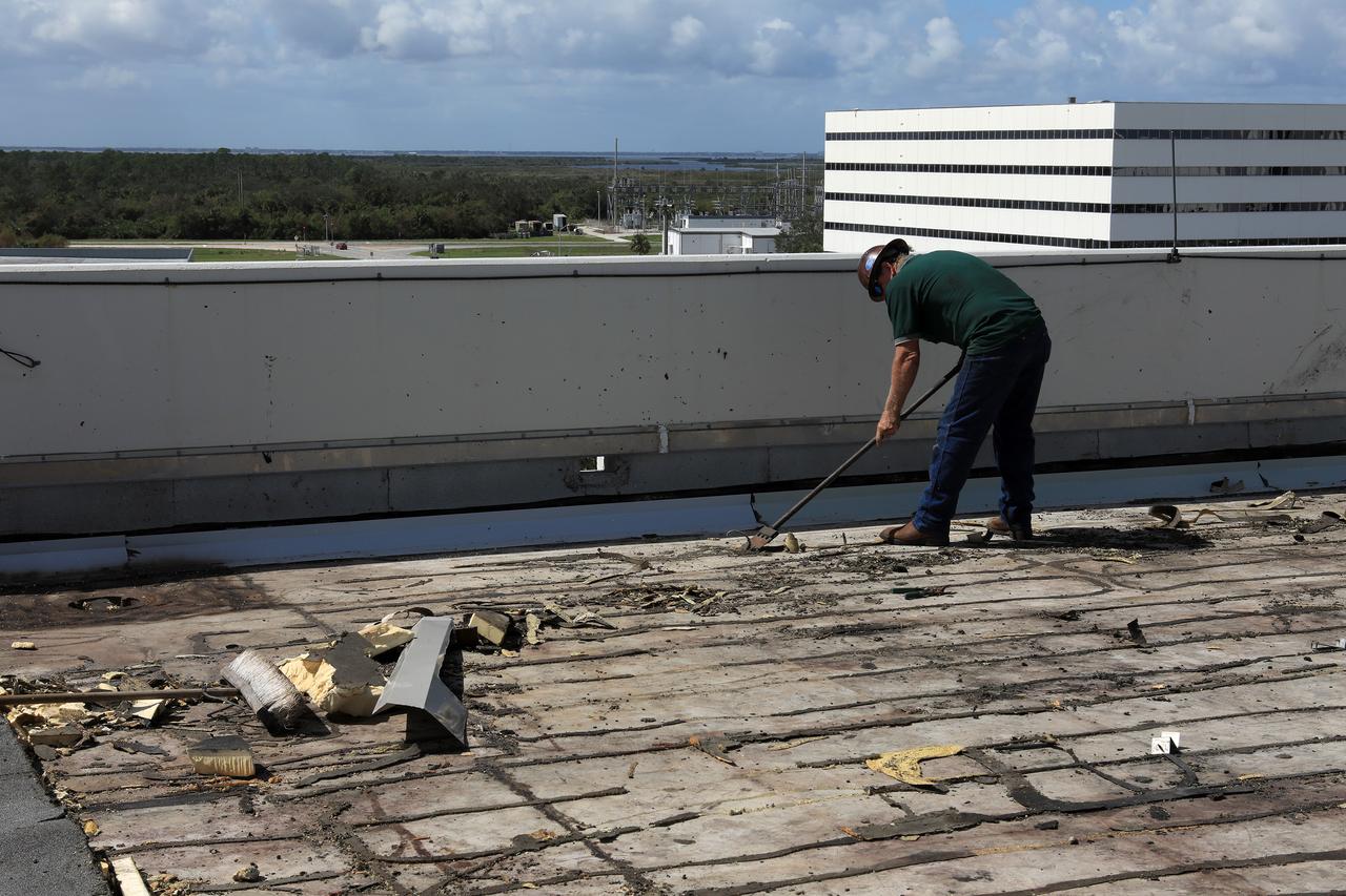 Members of the Disaster Assessment and Recovery Team (DART) repair a section of roof atop the Operations Support Building II at NASA’s Kennedy Space Center in Florida.  The effort is part of the spaceport’s ongoing recovery from Hurricane Matthew, which passed to the east of Kennedy on Oct. 6 and 7, 2016. The center received some isolated roof damage, damaged support buildings, a few downed power lines, and limited water intrusion. Beach erosion also occurred, although the storm surge was less than expected.