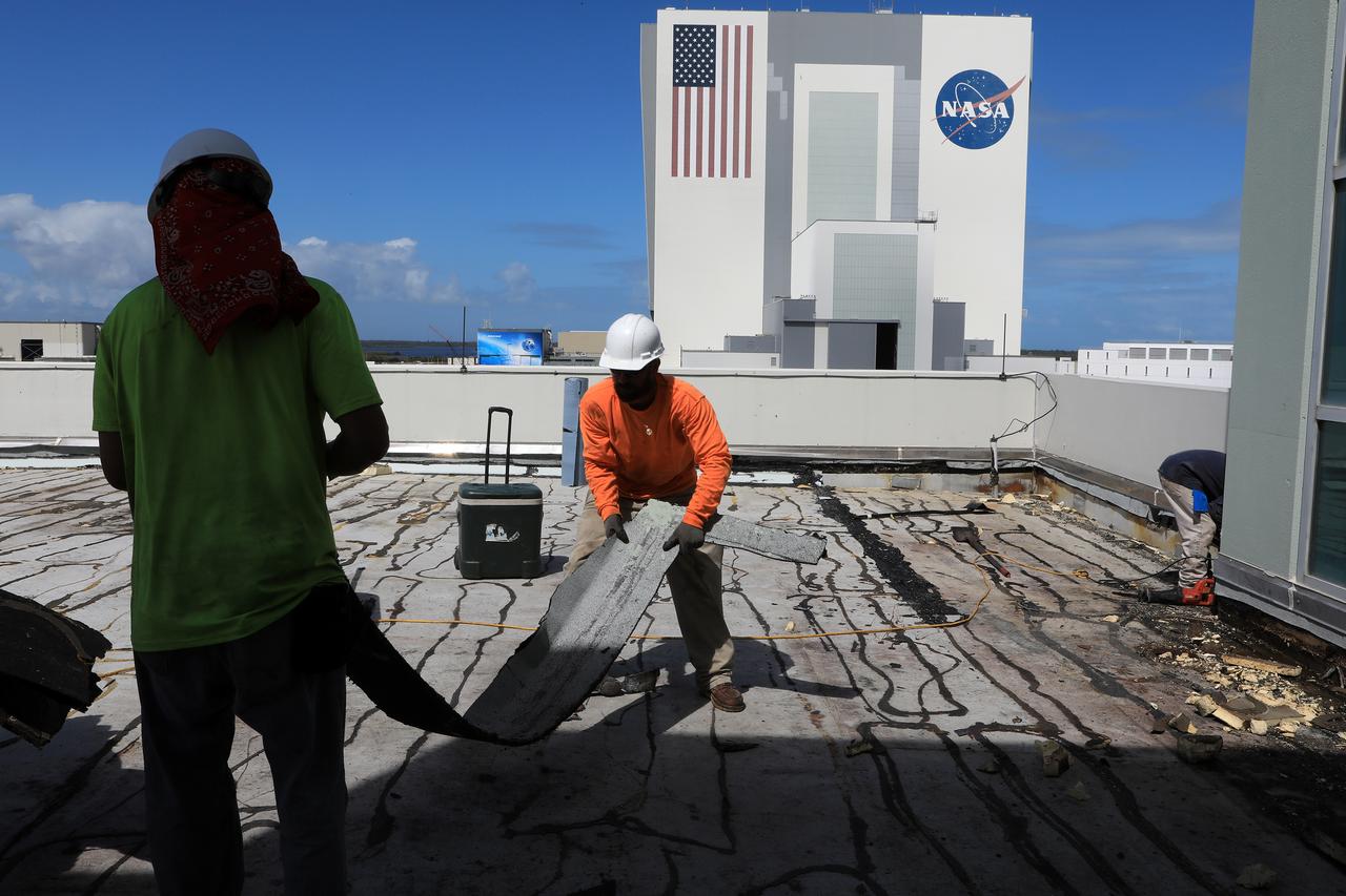 Members of the Disaster Assessment and Recovery Team (DART) repair a section of roof atop the Operations Support Building II at NASA’s Kennedy Space Center in Florida. The effort is part of the spaceport’s ongoing recovery from Hurricane Matthew, which passed to the east of Kennedy on Oct. 6 and 7, 2016. The center received some isolated roof damage, damaged support buildings, a few downed power lines, and limited water intrusion. Beach erosion also occurred, although the storm surge was less than expected.