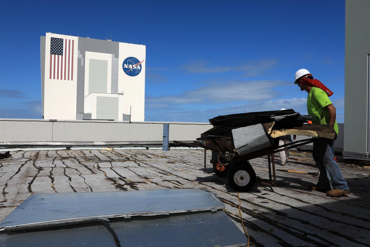Members of the Disaster Assessment and Recovery Team (DART) repair a section of roof atop the Operations Support Building II at NASA’s Kennedy Space Center in Florida. The effort is part of the spaceport’s ongoing recovery from Hurricane Matthew, which passed to the east of Kennedy on Oct. 6 and 7, 2016. The center received some isolated roof damage, damaged support buildings, a few downed power lines, and limited water intrusion. Beach erosion also occurred, although the storm surge was less than expected.