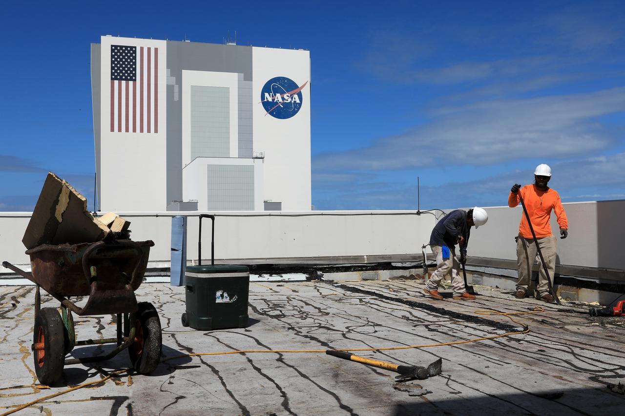 Members of the Disaster Assessment and Recovery Team (DART) repair a section of roof atop the Operations Support Building II at NASA’s Kennedy Space Center in Florida.  The effort is part of the spaceport’s ongoing recovery from Hurricane Matthew, which passed to the east of Kennedy on Oct. 6 and 7, 2016. The center received some isolated roof damage, damaged support buildings, a few downed power lines, and limited water intrusion. Beach erosion also occurred, although the storm surge was less than expected.