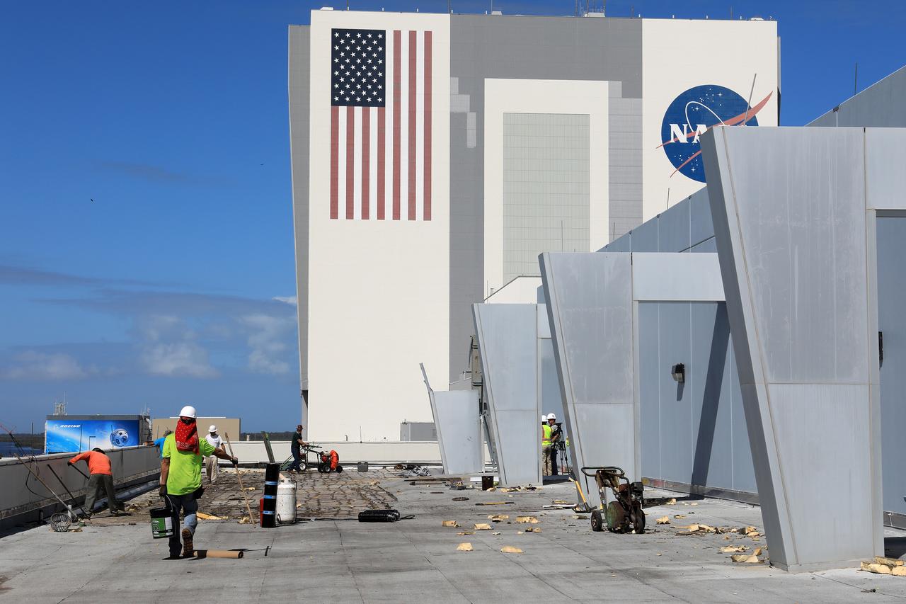 Members of the Disaster Assessment and Recovery Team (DART) repair a section of roof atop the Operations Support Building II at NASA’s Kennedy Space Center in Florida.  The effort is part of the spaceport’s ongoing recovery from Hurricane Matthew, which passed to the east of Kennedy on Oct. 6 and 7, 2016. The center received some isolated roof damage, damaged support buildings, a few downed power lines, and limited water intrusion. Beach erosion also occurred, although the storm surge was less than expected.