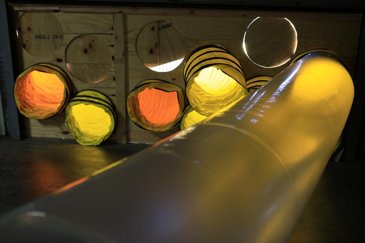 Tubing provides ventilation through boarded-up windows on the Operations Support Building II at NASA’s Kennedy Space Center in Florida.  Members of the Disaster Assessment and Recovery Team (DART) are working on repairs to the facility following Hurricane Matthew, which passed to the east of Kennedy on Oct. 6 and 7, 2016. The center received some isolated roof damage, damaged support buildings, a few downed power lines, and limited water intrusion. Beach erosion also occurred, although the storm surge was less than expected.