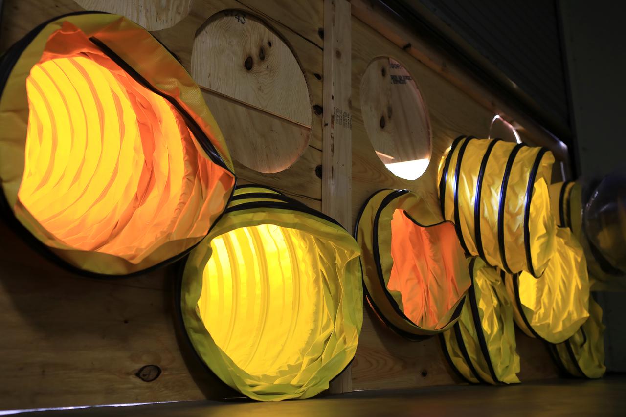 Tubing provides ventilation through boarded-up windows on the Operations Support Building II at NASA’s Kennedy Space Center in Florida.  Members of the Disaster Assessment and Recovery Team (DART) are working on repairs to the facility following Hurricane Matthew, which passed to the east of Kennedy on Oct. 6 and 7, 2016. The center received some isolated roof damage, damaged support buildings, a few downed power lines, and limited water intrusion. Beach erosion also occurred, although the storm surge was less than expected.
