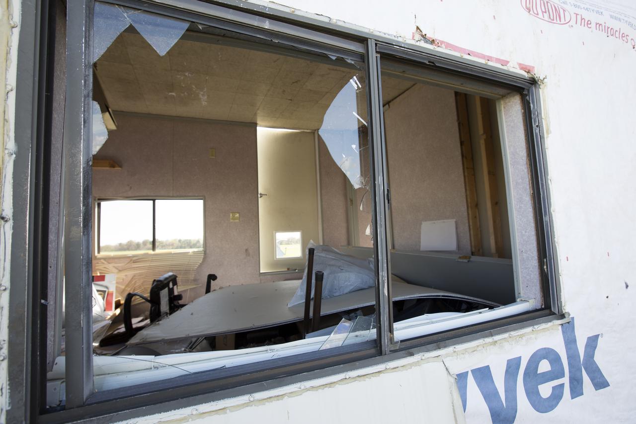 A broken window caused by Hurricane Matthew is seen inside a support building in the Launch Complex 39 area at NASA's Kennedy Space Center in Florida.  Assessments and repairs are in progress at various structures and facilities across the spaceport, part of the ongoing recovery from Hurricane Matthew, which passed to the east of Kennedy on Oct. 6 and 7, 2016. The center received some isolated roof damage, damaged support buildings, a few downed power lines, and limited water intrusion. Beach erosion also occurred, although the storm surge was less than expected.
