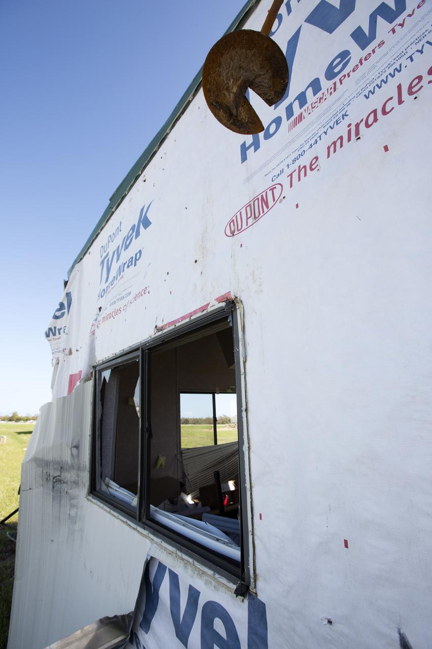 A construction trailer damaged by Hurricane Matthew is seen in the Launch Complex 39 area at NASA's Kennedy Space Center in Florida.  Assessments and repairs are in progress at various structures and facilities across the spaceport, part of the ongoing recovery from Hurricane Matthew, which passed to the east of Kennedy on Oct. 6 and 7, 2016. The center received some isolated roof damage, damaged support buildings, a few downed power lines, and limited water intrusion. Beach erosion also occurred, although the storm surge was less than expected.