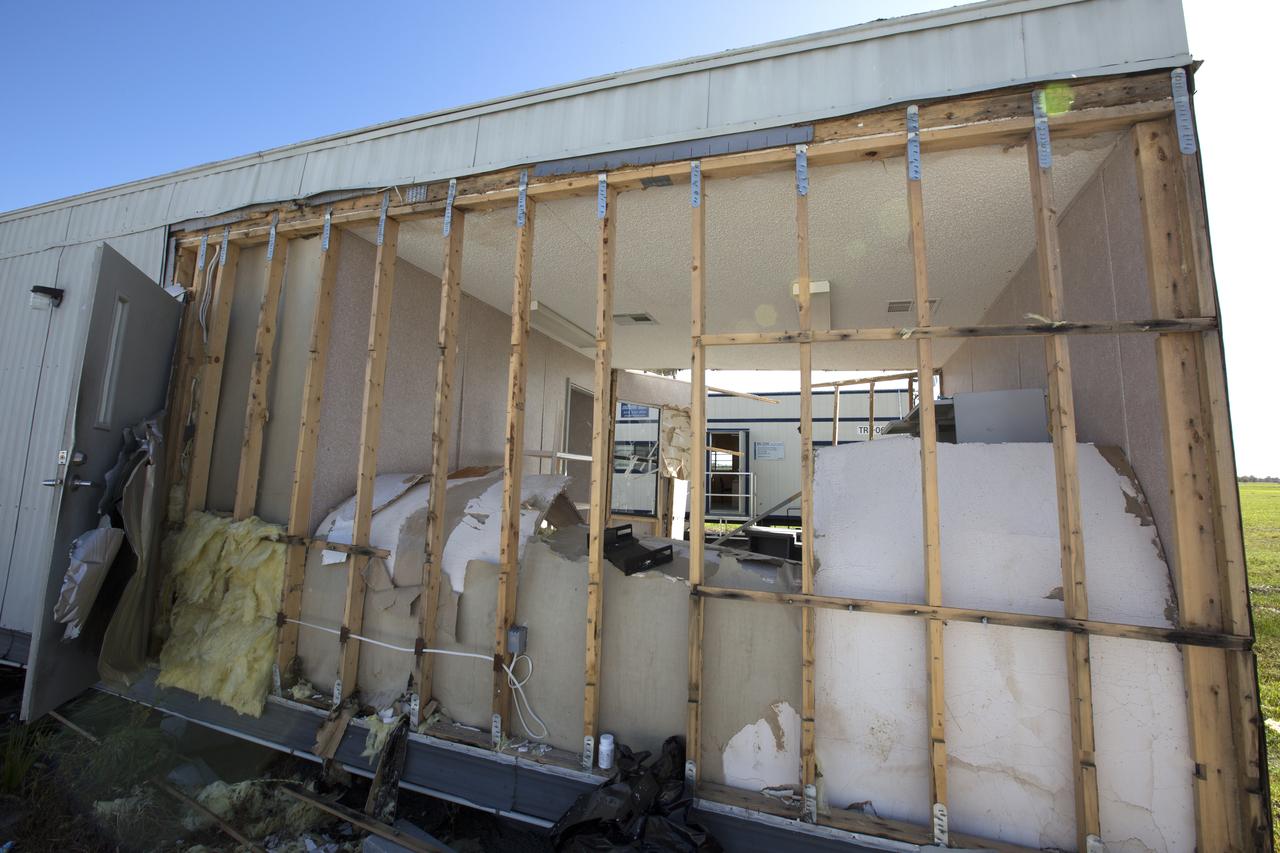 Hurricane Matthew tore away a section of wall on a support building in the Launch Complex 39 area at NASA's Kennedy Space Center in Florida.  Assessments and repairs are in progress at various structures and facilities across the spaceport, part of the ongoing recovery from Hurricane Matthew, which passed to the east of Kennedy on Oct. 6 and 7, 2016. The center received some isolated roof damage, damaged support buildings, a few downed power lines, and limited water intrusion. Beach erosion also occurred, although the storm surge was less than expected.