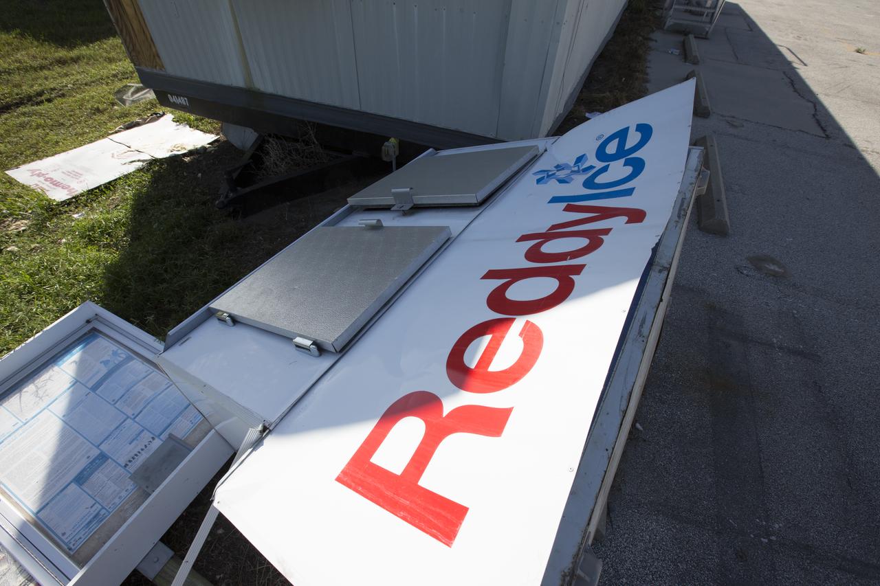 An ice dispenser damaged by Hurricane Matthew is seen in the Launch Complex 39 area at NASA's Kennedy Space Center in Florida.  Assessments and repairs are in progress at various structures and facilities across the spaceport, part of the ongoing recovery from Hurricane Matthew, which passed to the east of Kennedy on Oct. 6 and 7, 2016. The center received some isolated roof damage, damaged support buildings, a few downed power lines, and limited water intrusion. Beach erosion also occurred, although the storm surge was less than expected.