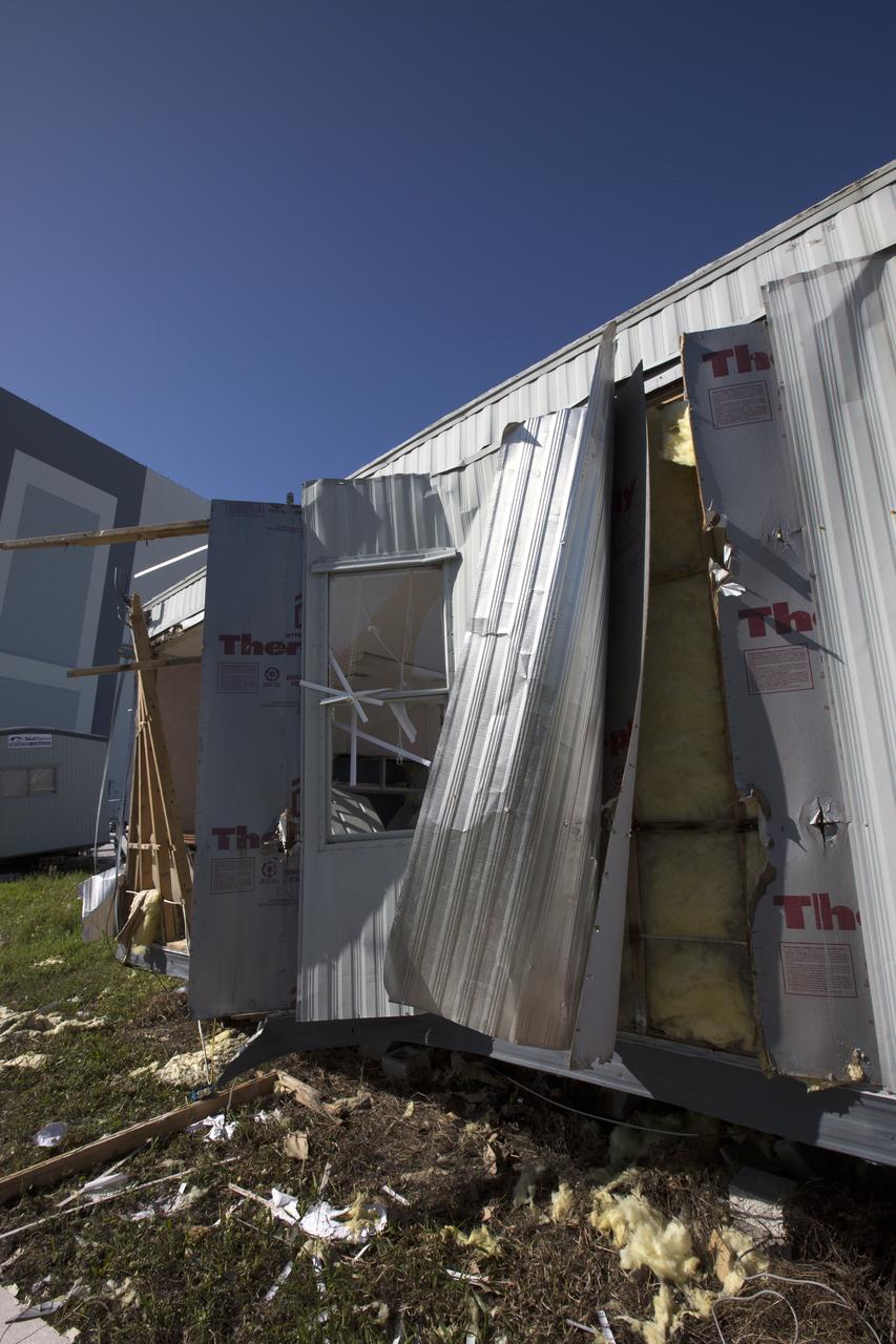 Siding damage caused by Hurricane Matthew is seen inside a support building in the Launch Complex 39 area at NASA's Kennedy Space Center in Florida.  Assessments and repairs are in progress at various structures and facilities across the spaceport, part of the ongoing recovery from Hurricane Matthew, which passed to the east of Kennedy on Oct. 6 and 7, 2016. The center received some isolated roof damage, damaged support buildings, a few downed power lines, and limited water intrusion. Beach erosion also occurred, although the storm surge was less than expected.