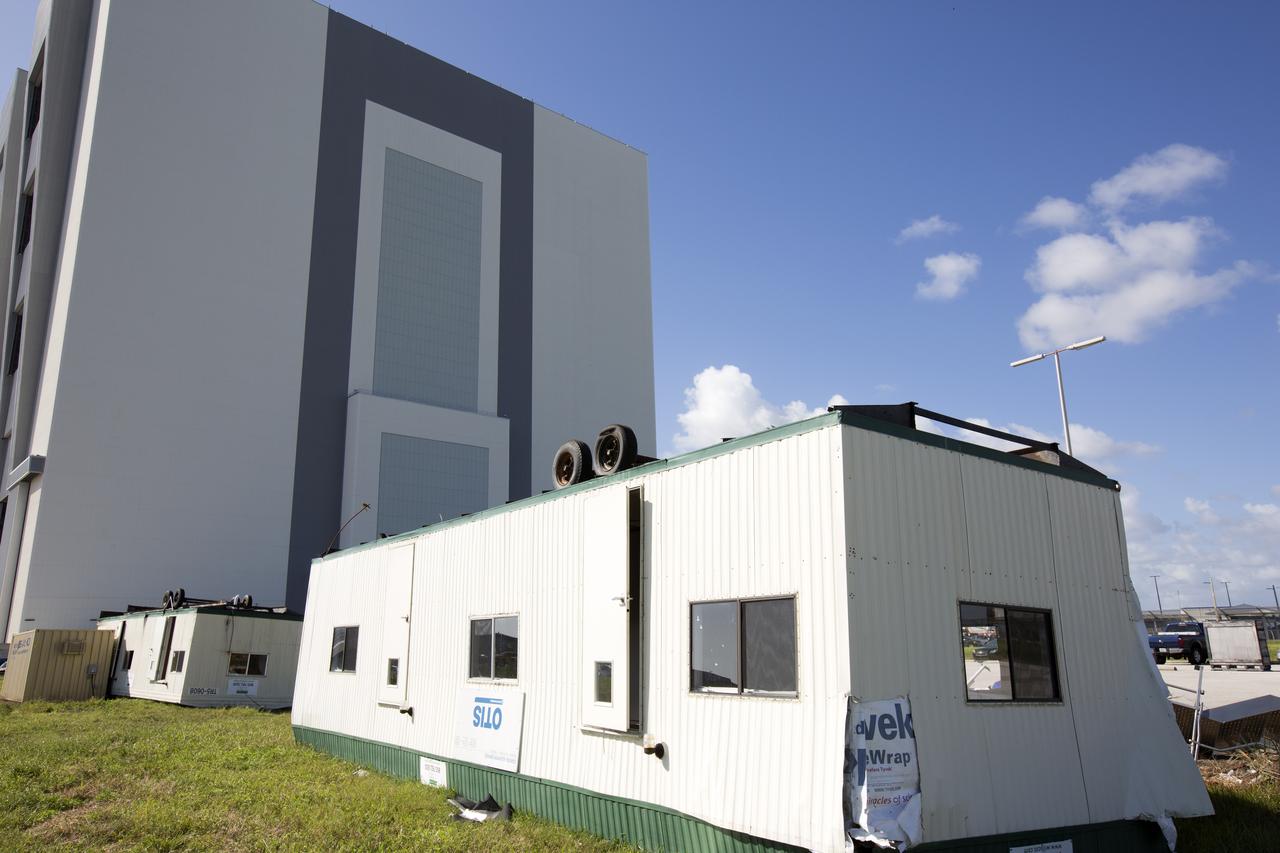 A construction trailer damaged by Hurricane Matthew is seen in the Launch Complex 39 area at NASA's Kennedy Space Center in Florida.  Assessments and repairs are in progress at various structures and facilities across the spaceport, part of the ongoing recovery from Hurricane Matthew, which passed to the east of Kennedy on Oct. 6 and 7, 2016. The center received some isolated roof damage, damaged support buildings, a few downed power lines, and limited water intrusion. Beach erosion also occurred, although the storm surge was less than expected.