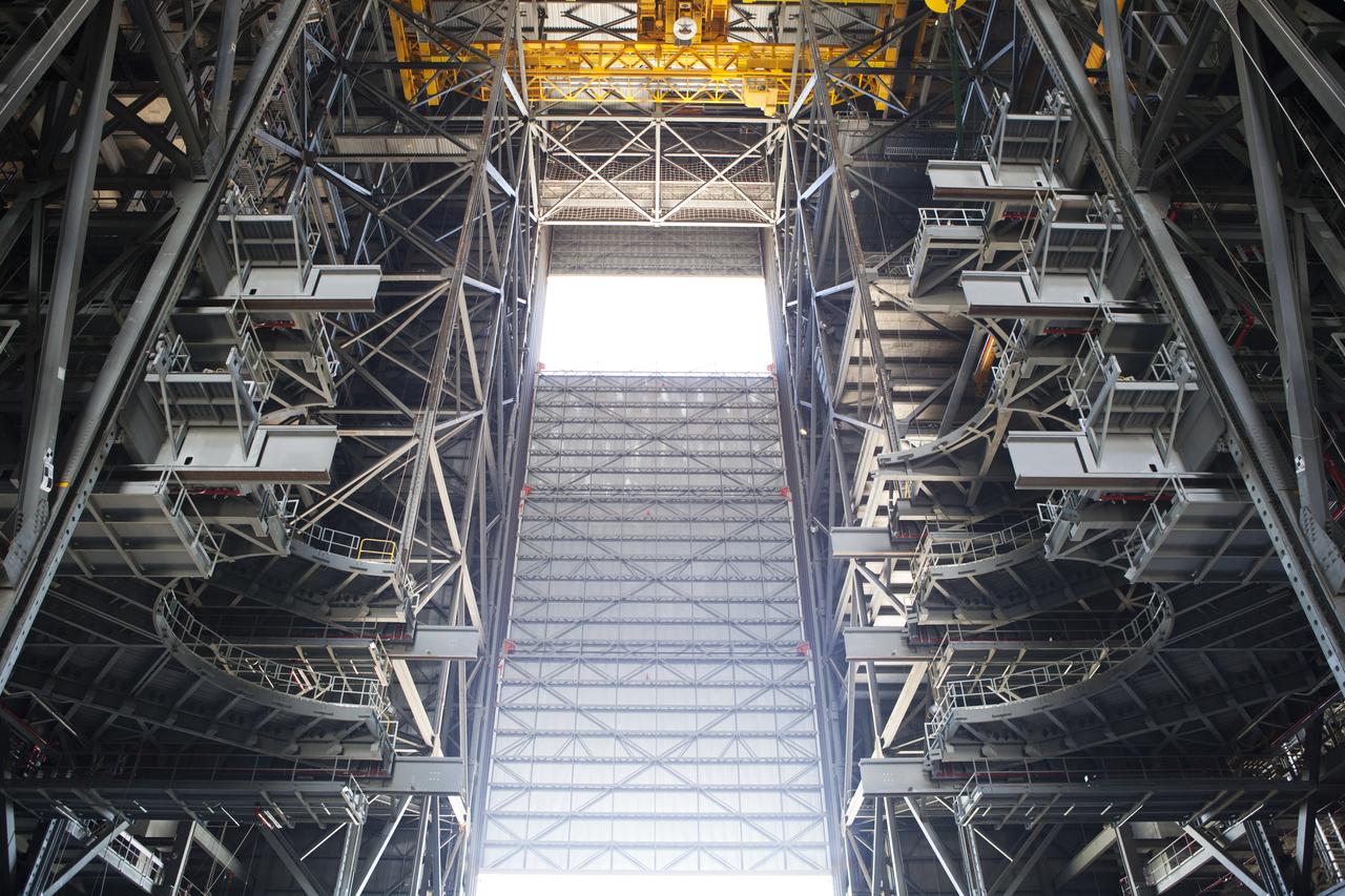 Inside the Vehicle Assembly Building at NASA’s Kennedy Space Center in Florida, the first half of the C-level work platforms, C south, for NASA’s Space Launch System (SLS) rocket, has been installed on the south side of the high bay. In view below are several levels of previously installed platforms. The C platforms are the eighth of 10 levels of work platforms that will surround and provide access to the SLS rocket and Orion spacecraft for Exploration Mission 1. The Ground Systems Development and Operations Program is overseeing upgrades and modifications to VAB High Bay 3, including installation of the new work platforms, to prepare for NASA’s Journey to Mars.
