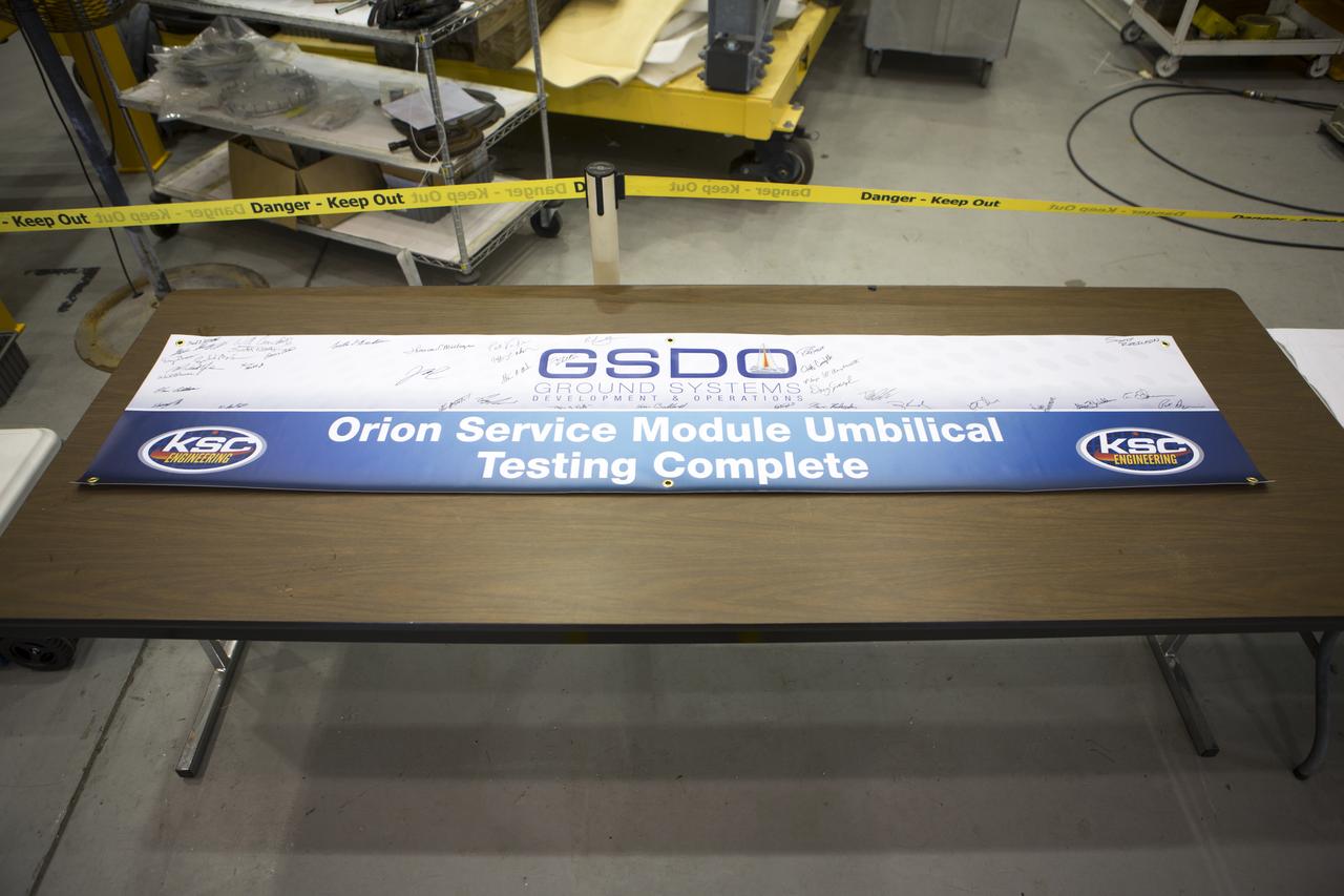 Testing of the Orion Service Module Umbilical (OSMU) was completed at the Launch Equipment Test Facility at NASA’s Kennedy Space Center in Florida. The OSMU was attached to Vehicle Motion Simulator 1 for a series of simulated launch tests to validate it for installation on the mobile launcher. The test team signed a special banner during an event to mark the end of testing. The mobile launcher tower will be equipped with a number of lines, called umbilicals that will connect to the Space Launch System rocket and Orion spacecraft for Exploration Mission-1 (EM-1). The OSMU will be located high on the mobile launcher tower and, prior to launch, will transfer liquid coolant for the electronics and air for the Environmental Control System to the Orion service module that houses these critical systems to support the spacecraft. Kennedy's Engineering Directorate is providing support to the Ground Systems Development and Operations Program for testing of the OSMU. EM-1 is scheduled to launch in 2018.