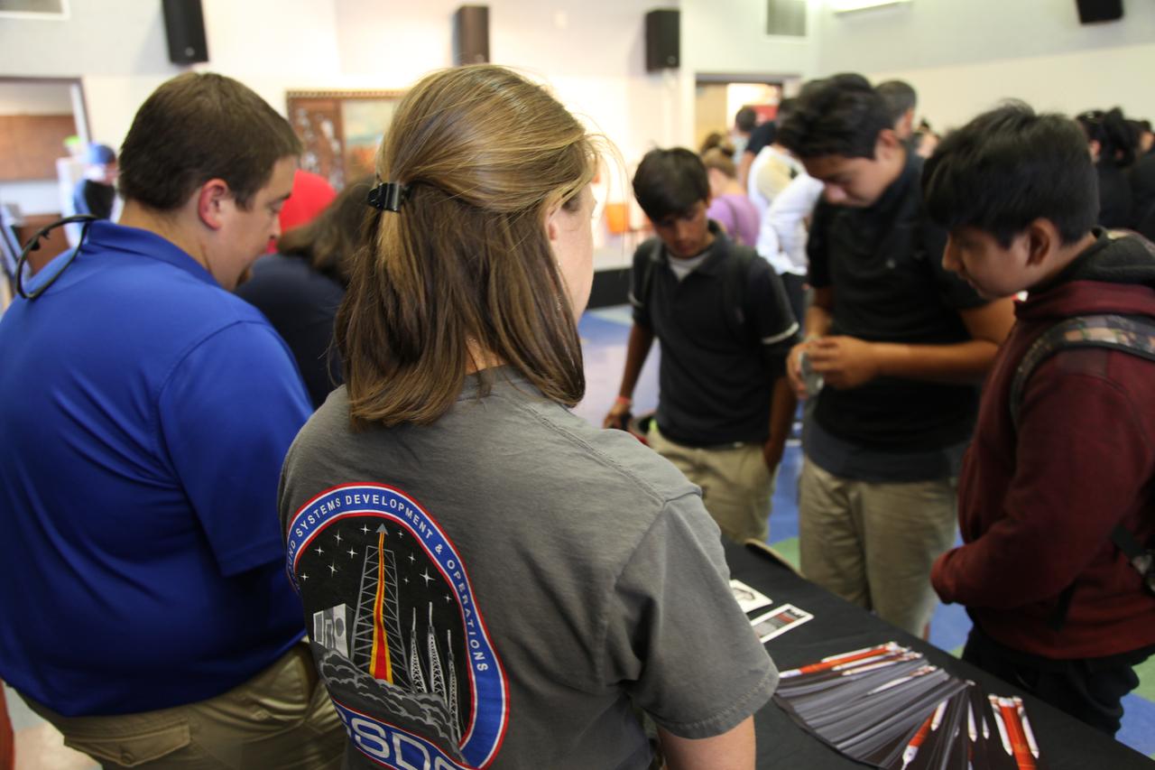 Students visit the displays at the Logan Heights Library in San Diego, California, during the “52 Weeks of Science” celebration. The Ground Systems Development and Operations (GSDO) Program is participating in the special event with a Journey to Mars display before the start of Underway Recovery Test 5 using a test version of the Orion spacecraft in the Pacific Ocean off the coast of California. The test will allow NASA, Orion manufacturer Lockheed Martin and the U.S. Navy to demonstrate and evaluate the recovery processes, procedures, hardware and personnel necessary for recovery of the Orion crew module on its return from a deep space mission. Orion is the exploration spacecraft designed to carry astronauts to destinations not yet explored by humans, including an asteroid and NASA Journey to Mars. It will have emergency abort capability, sustain the crew during space travel and provide safe re-entry from deep space return velocities. Orion is scheduled to launch atop NASA’s Space Launch System rocket in 2018. For more information, visit http://www.nasa.gov/orion. 