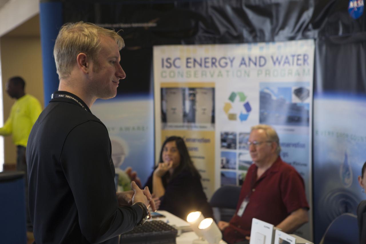 Cory Taylor, an energy and water conservation specialist at Kennedy Space Center, absorbs information at the Multi-Function Facility on Oct. 20. Every third Thursday of October, civil servants, contractors and several energy utilities promote the awareness of our sustainability goals at Kennedy Space Center and at home. Photo credit: Cory Huston