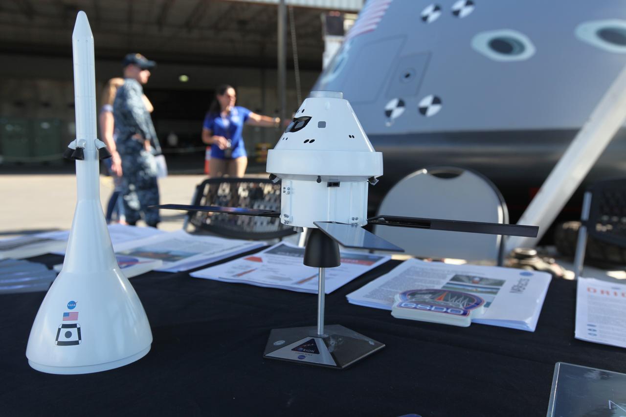 Models of the Orion spacecraft and Launch Abort System are on display for viewing at Naval Base San Diego in California. Service members, base employees and their families had the opportunity to view a test version of the Orion crew module (in view in the background) before Underway Recovery Test 5 (URT-5). NASA, Orion manufacturer Lockheed Martin and the U.S. Navy will head out to sea with the Orion test vehicle aboard the USS San Diego to demonstrate and evaluate the recovery processes, procedures, hardware and personnel necessary for recovery of Orion on its return from a deep space mission. Orion is the exploration spacecraft designed to carry astronauts to destinations not yet explored by humans, including an asteroid and NASA Journey to Mars. It will have emergency abort capability, sustain the crew during space travel and provide safe re-entry from deep space return velocities. Orion is scheduled to launch atop NASA’s Space Launch System rocket in 2018. For more information, visit http://www.nasa.gov/orion.