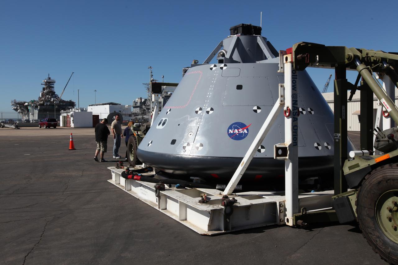 Service members, base employees and their families view a test version of the Orion crew module on display at Naval Base San Diego in California, before Underway Recovery Test 5 (URT-5). NASA, Orion manufacturer Lockheed Martin and the U.S. Navy will head out to sea with the Orion test vehicle aboard the USS San Diego to demonstrate and evaluate the recovery processes, procedures, hardware and personnel necessary for recovery of Orion on its return from a deep space mission. Orion is the exploration spacecraft designed to carry astronauts to destinations not yet explored by humans, including an asteroid and NASA Journey to Mars. It will have emergency abort capability, sustain the crew during space travel and provide safe re-entry from deep space return velocities. Orion is scheduled to launch atop NASA’s Space Launch System rocket in 2018. For more information, visit http://www.nasa.gov/orion. 