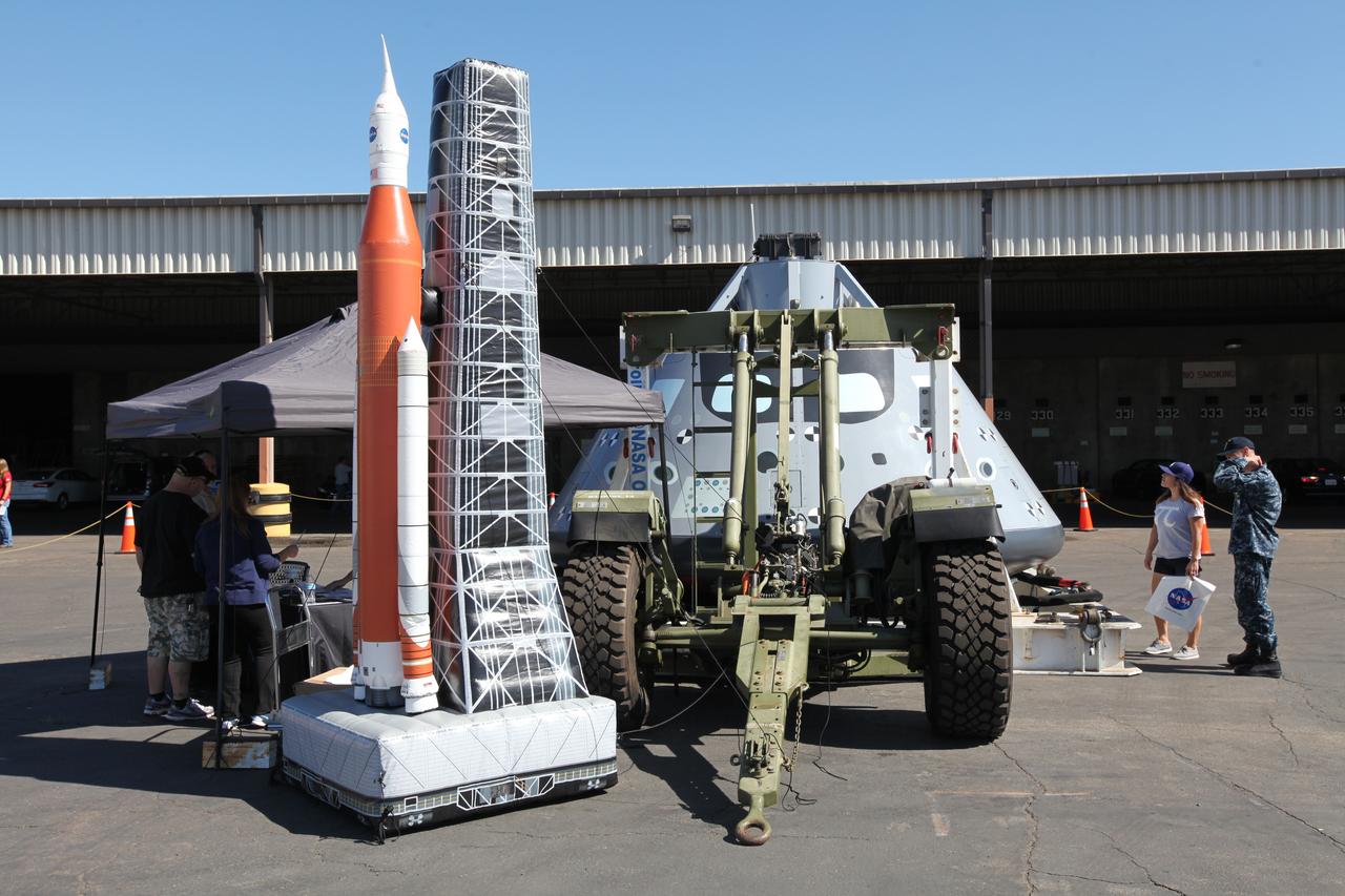 A test version of the Orion crew module and an inflatable model of NASA’s Space Launch System rocket, Orion spacecraft and mobile launcher are on display at Naval Base San Diego in California, for viewing by service members, base employees and their families before Underway Recovery Test 5 (URT-5). NASA, Orion manufacturer Lockheed Martin and the U.S. Navy will head out to sea with the Orion test vehicle aboard the USS San Diego to demonstrate and evaluate the recovery processes, procedures, hardware and personnel necessary for recovery of Orion on its return from a deep space mission. Orion is the exploration spacecraft designed to carry astronauts to destinations not yet explored by humans, including an asteroid and NASA Journey to Mars. It will have emergency abort capability, sustain the crew during space travel and provide safe re-entry from deep space return velocities. Orion is scheduled to launch atop NASA’s Space Launch System rocket in 2018. For more information, visit http://www.nasa.gov/orion.