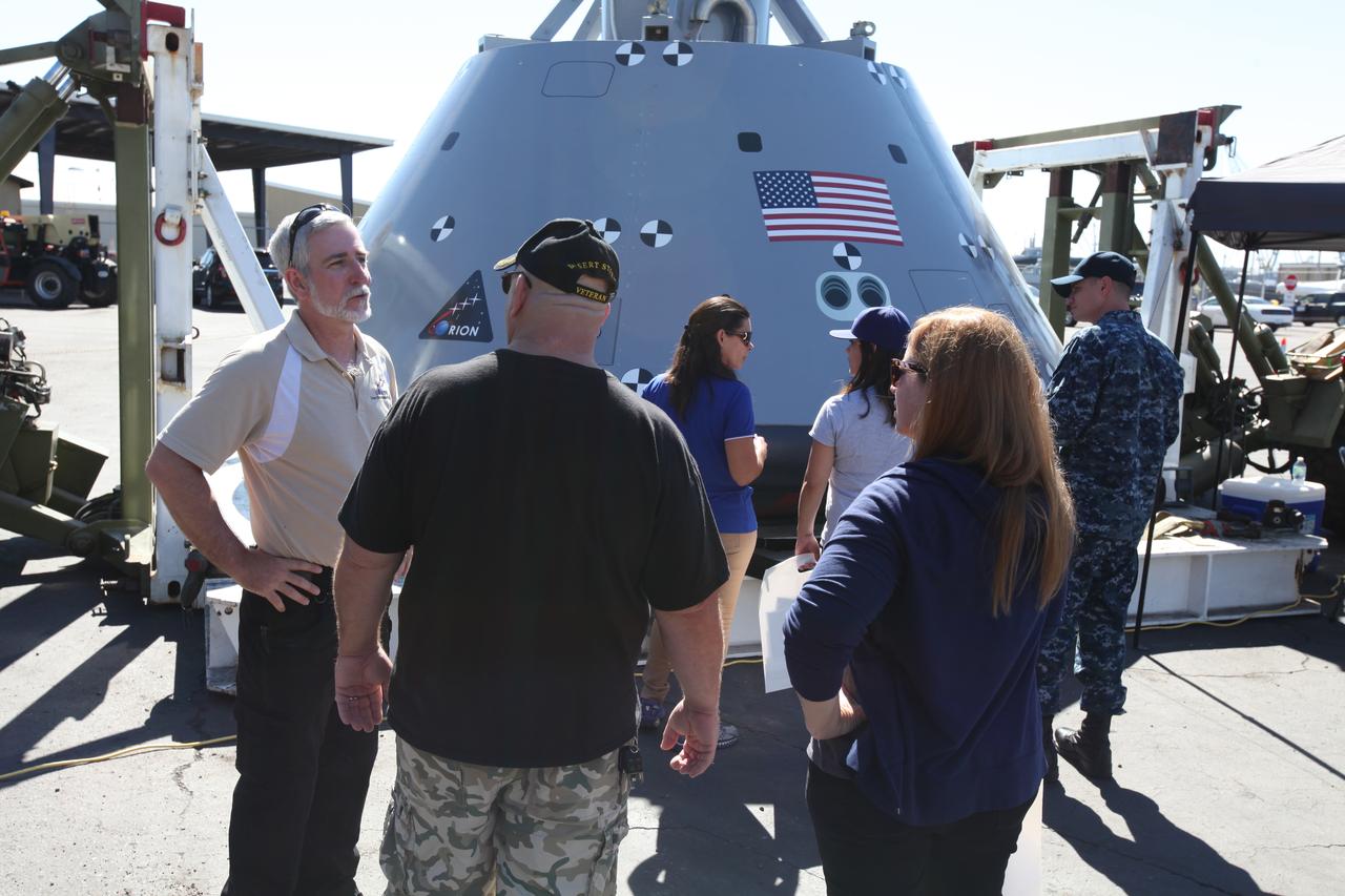 Service members, base employees and their families check out a test version of the Orion crew module on display at Naval Base San Diego in California, before Underway Recovery Test 5 (URT-5). NASA, Orion manufacturer Lockheed Martin and the U.S. Navy will head out to sea with the Orion test vehicle aboard the USS San Diego to demonstrate and evaluate the recovery processes, procedures, hardware and personnel necessary for recovery of Orion on its return from a deep space mission. Orion is the exploration spacecraft designed to carry astronauts to destinations not yet explored by humans, including an asteroid and NASA Journey to Mars. It will have emergency abort capability, sustain the crew during space travel and provide safe re-entry from deep space return velocities. Orion is scheduled to launch atop NASA’s Space Launch System rocket in 2018. For more information, visit http://www.nasa.gov/orion.