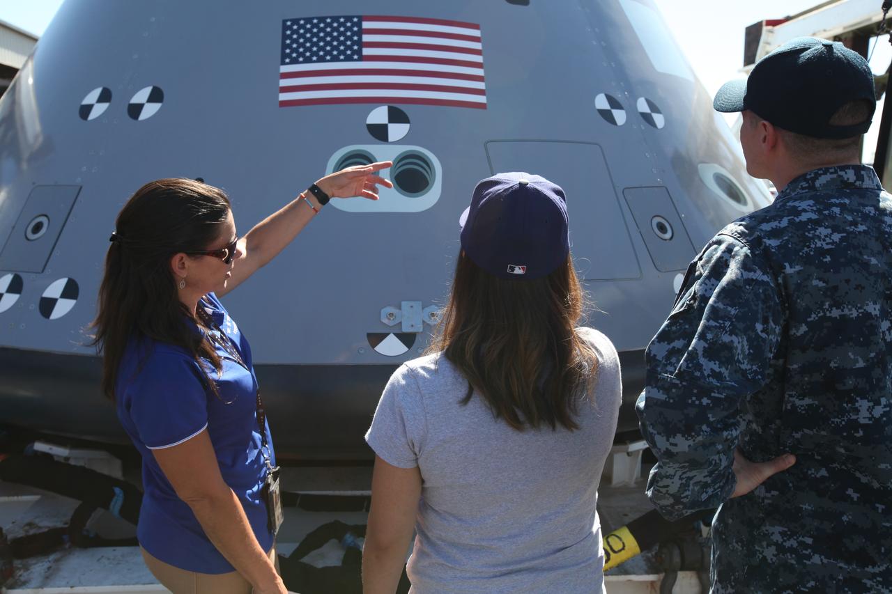 A service member and his family check out a test version of the Orion crew module on display at Naval Base San Diego in California, before Underway Recovery Test 5 (URT-5). NASA, Orion manufacturer Lockheed Martin and the U.S. Navy will head out to sea with the Orion test vehicle aboard the USS San Diego to demonstrate and evaluate the recovery processes, procedures, hardware and personnel necessary for recovery of Orion on its return from a deep space mission. Orion is the exploration spacecraft designed to carry astronauts to destinations not yet explored by humans, including an asteroid and NASA Journey to Mars. It will have emergency abort capability, sustain the crew during space travel and provide safe re-entry from deep space return velocities. Orion is scheduled to launch atop NASA’s Space Launch System rocket in 2018. For more information, visit http://www.nasa.gov/orion.