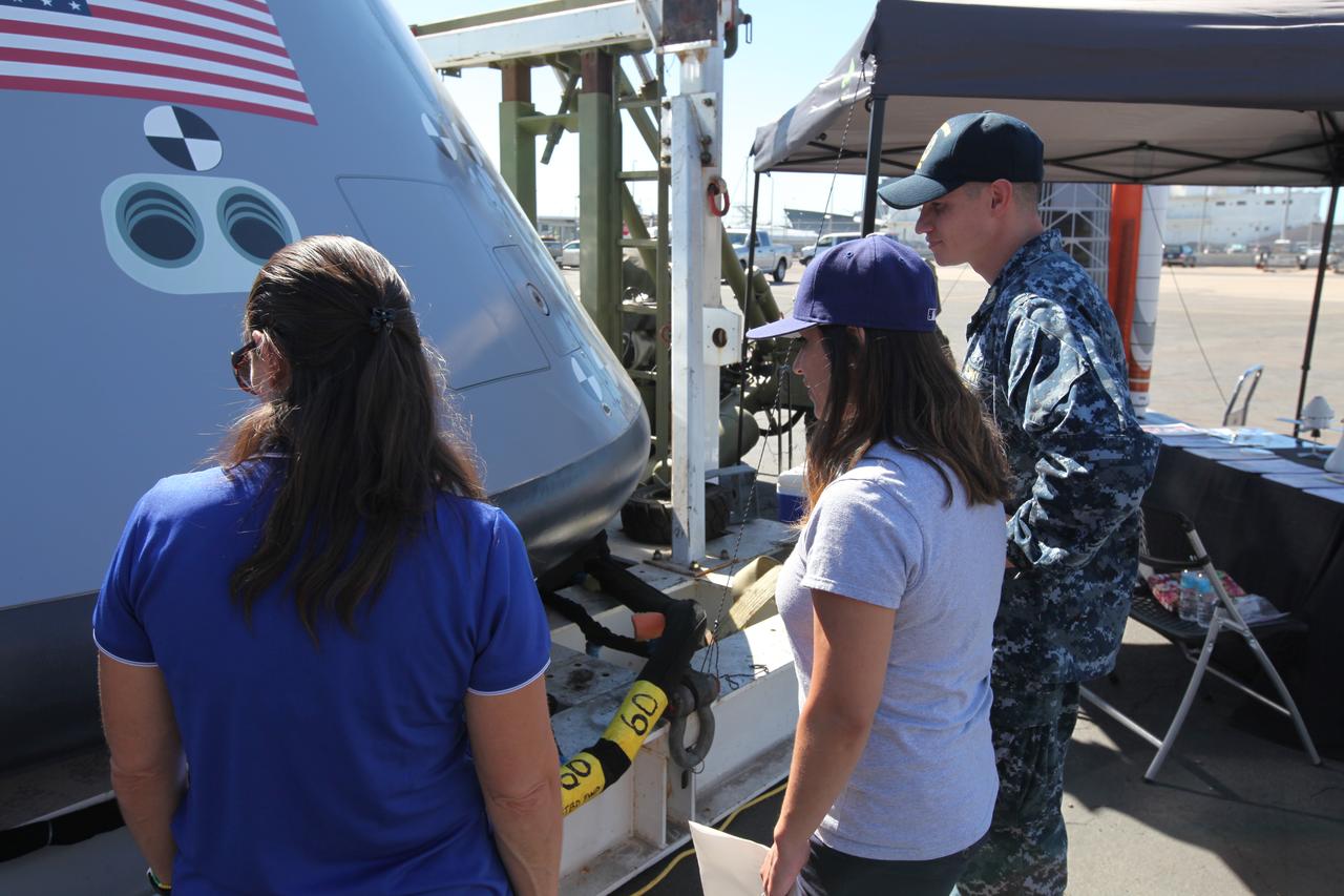 A service member and his family check out a test version of the Orion crew module on display at Naval Base San Diego in California, before Underway Recovery Test 5 (URT-5). NASA, Orion manufacturer Lockheed Martin and the U.S. Navy will head out to sea with the Orion test vehicle aboard the USS San Diego to demonstrate and evaluate the recovery processes, procedures, hardware and personnel necessary for recovery of Orion on its return from a deep space mission. Orion is the exploration spacecraft designed to carry astronauts to destinations not yet explored by humans, including an asteroid and NASA Journey to Mars. It will have emergency abort capability, sustain the crew during space travel and provide safe re-entry from deep space return velocities. Orion is scheduled to launch atop NASA’s Space Launch System rocket in 2018. For more information, visit http://www.nasa.gov/orion.
