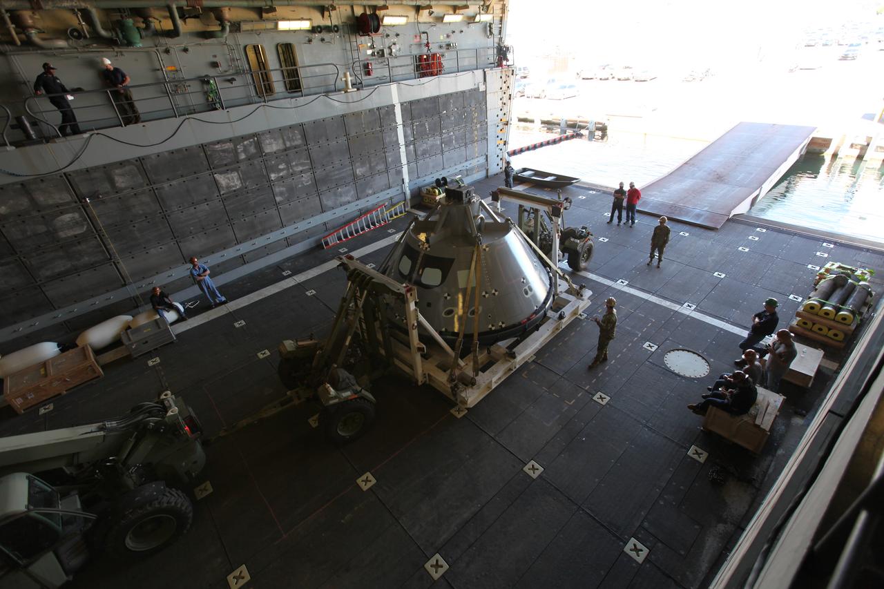 The test version of the Orion crew module has been transported into the well deck of the USS San Diego at Naval Base San Diego in California. NASA, Orion manufacturer Lockheed Martin and the U.S. Navy will head out to sea with the Orion test spacecraft aboard for Underway Recovery Test 5 (URT-5) in the Pacific Ocean off the coast of California. During URT-5, the team will demonstrate and evaluate the recovery processes, procedures, hardware and personnel necessary for recovery of Orion on its return from a deep space mission. Orion is the exploration spacecraft designed to carry astronauts to destinations not yet explored by humans, including an asteroid and NASA Journey to Mars. It will have emergency abort capability, sustain the crew during space travel and provide safe re-entry from deep space return velocities. Orion is scheduled to launch atop NASA’s Space Launch System rocket in 2018. For more information, visit http://www.nasa.gov/orion. 