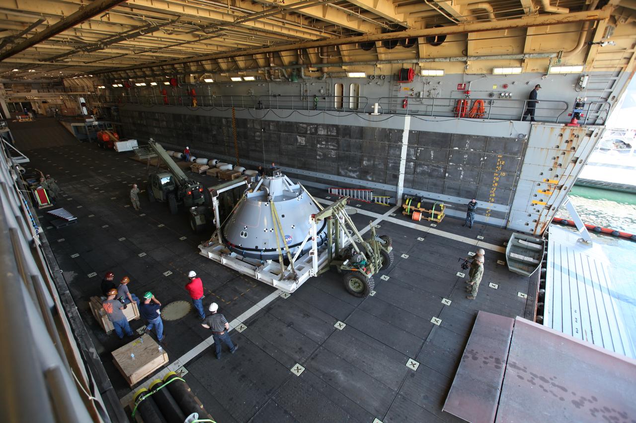The test version of the Orion crew module has been transported into the well deck of the USS San Diego at Naval Base San Diego in California. NASA, Orion manufacturer Lockheed Martin and the U.S. Navy will head out to sea with the Orion test spacecraft aboard for Underway Recovery Test 5 (URT-5) in the Pacific Ocean off the coast of California. During URT-5, the team will demonstrate and evaluate the recovery processes, procedures, hardware and personnel necessary for recovery of Orion on its return from a deep space mission. Orion is the exploration spacecraft designed to carry astronauts to destinations not yet explored by humans, including an asteroid and NASA Journey to Mars. It will have emergency abort capability, sustain the crew during space travel and provide safe re-entry from deep space return velocities. Orion is scheduled to launch atop NASA’s Space Launch System rocket in 2018. For more information, visit http://www.nasa.gov/orion. 