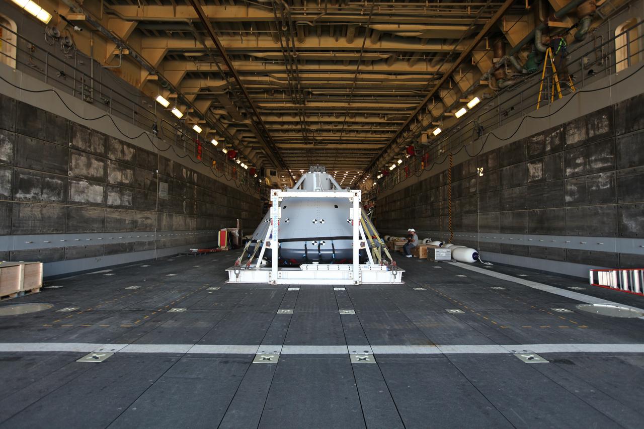 The test version of the Orion crew module is secured on its fixture inside the well deck of the USS San Diego at Naval Base San Diego in California. NASA, Orion manufacturer Lockheed Martin and the U.S. Navy will head out to sea with the Orion test spacecraft aboard for Underway Recovery Test 5 (URT-5) in the Pacific Ocean off the coast of California. During URT-5, the team will demonstrate and evaluate the recovery processes, procedures, hardware and personnel necessary for recovery of Orion on its return from a deep space mission. Orion is the exploration spacecraft designed to carry astronauts to destinations not yet explored by humans, including an asteroid and NASA Journey to Mars. It will have emergency abort capability, sustain the crew during space travel and provide safe re-entry from deep space return velocities. Orion is scheduled to launch atop NASA’s Space Launch System rocket in 2018. For more information, visit http://www.nasa.gov/orion. 