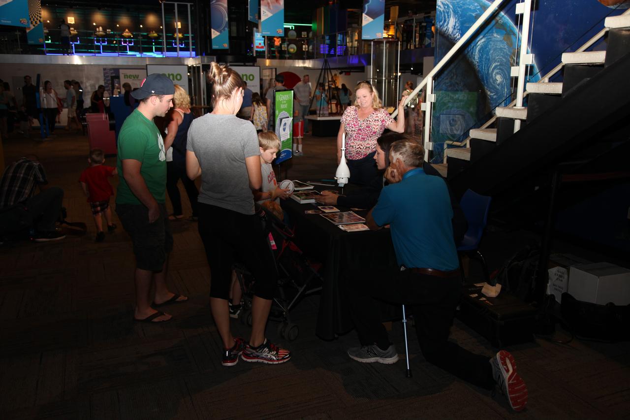 Visitors talk to representatives from NASA’s Ground Systems Development and Operations Program (GSDO) at the Reuben H. Fleet Science Center in San Diego, California. GSDO participated in the “Genius in the House” event at the science center before the start of the Orion Underway Recovery Test 5 (URT-5) using a test version of the Orion crew module in the Pacific Ocean off the coast of California. URT-5 will allow NASA, Orion manufacturer Lockheed Martin and the U.S. Navy to demonstrate and evaluate the recovery processes, procedures, hardware and personnel necessary for recovery of the Orion crew module on its return from a deep space mission. Orion is the exploration spacecraft designed to carry astronauts to destinations not yet explored by humans, including an asteroid and NASA’s Journey to Mars. It will have emergency abort capability, sustain the crew during space travel and provide safe re-entry from deep space return velocities. Orion is scheduled to launch atop NASA’s Space Launch System rocket in 2018. For more information, visit http://www.nasa.gov/orion.