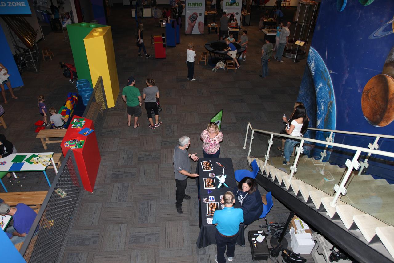 Visitors talk to representatives from NASA’s Ground Systems Development and Operations Program (GSDO) at the Reuben H. Fleet Science Center in San Diego, California. Melissa Jones, seated in blue, GSDO Landing and Recovery director, speaks to visitors during the “Genius in the House” event. GSDO participated in outreach events before the start of the Orion Underway Recovery Test 5 (URT-5) using a test version of the Orion crew module in the Pacific Ocean off the coast of California. URT-5 will allow NASA, Orion manufacturer Lockheed Martin and the U.S. Navy to demonstrate and evaluate the recovery processes, procedures, hardware and personnel necessary for recovery of the Orion crew module on its return from a deep space mission. Orion is the exploration spacecraft designed to carry astronauts to destinations not yet explored by humans, including an asteroid and NASA’s Journey to Mars. It will have emergency abort capability, sustain the crew during space travel and provide safe re-entry from deep space return velocities. Orion is scheduled to launch atop NASA’s Space Launch System rocket in 2018. For more information, visit http://www.nasa.gov/orion.