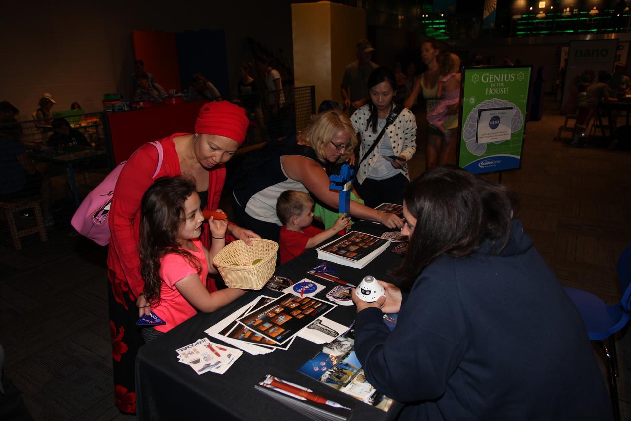 Melissa Jones, right, Landing and Recovery director with NASA’s Ground Systems Development and Operations Program speaks to visitors to the Reuben H. Fleet Science Center in San Diego, California, during a “Genius in the House” event. GSDO participated in several outreach events to students and the general public before the start of the Orion Underway Recovery Test 5 (URT-5) using a test version of the Orion crew module in the Pacific Ocean off the coast of California. URT-5 will allow NASA, Orion manufacturer Lockheed Martin and the U.S. Navy to demonstrate and evaluate the recovery processes, procedures, hardware and personnel necessary for recovery of the Orion crew module on its return from a deep space mission. Orion is the exploration spacecraft designed to carry astronauts to destinations not yet explored by humans, including an asteroid and NASA’s Journey to Mars. It will have emergency abort capability, sustain the crew during space travel and provide safe re-entry from deep space return velocities. Orion is scheduled to launch atop NASA’s Space Launch System rocket in 2018. For more information, visit http://www.nasa.gov/orion.