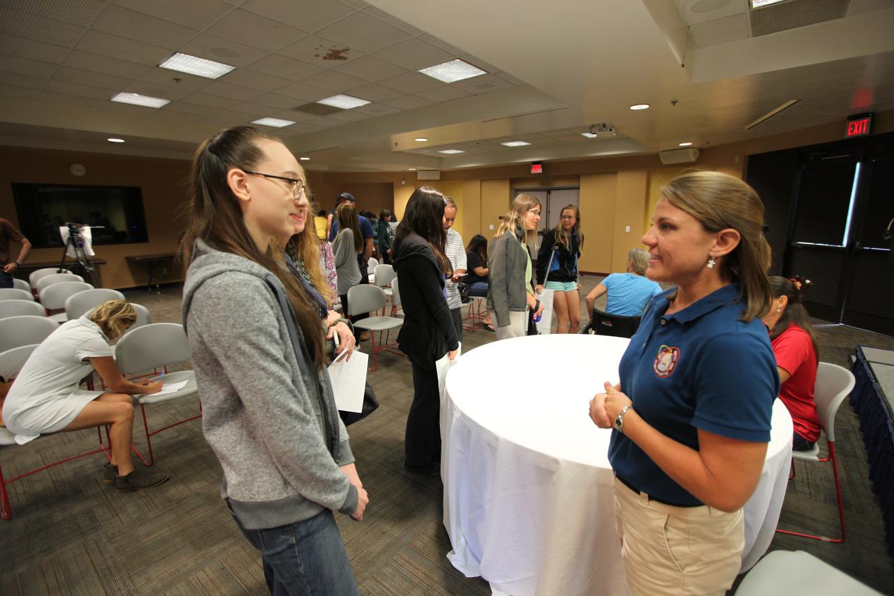 NASA’s Ground Systems Development and Operations Program (GSDO) participates in a “Be Wise” program at the Reuben H. Fleet Science Center in San Diego, California. Carla Koch, right, GSDO engineer from the agency’s Kennedy Space Center in Florida, talks with a student after the program. GSDO participated in several outreach events to students and the general public before the start of the Orion Underway Recovery Test 5 (URT-5) using a test version of the Orion crew module in the Pacific Ocean. URT-5 will allow NASA and the U.S. Navy to demonstrate and evaluate the recovery processes, procedures, hardware and personnel necessary for recovery of the Orion crew module on its return from a deep space mission. Orion is the exploration spacecraft designed to carry astronauts to destinations not yet explored by humans, including an asteroid and NASA’s Journey to Mars. It will have emergency abort capability, sustain the crew during space travel and provide safe re-entry from deep space return velocities. Orion is scheduled to launch atop NASA’s Space Launch System rocket in 2018. For more information, visit http://www.nasa.gov/orion. 