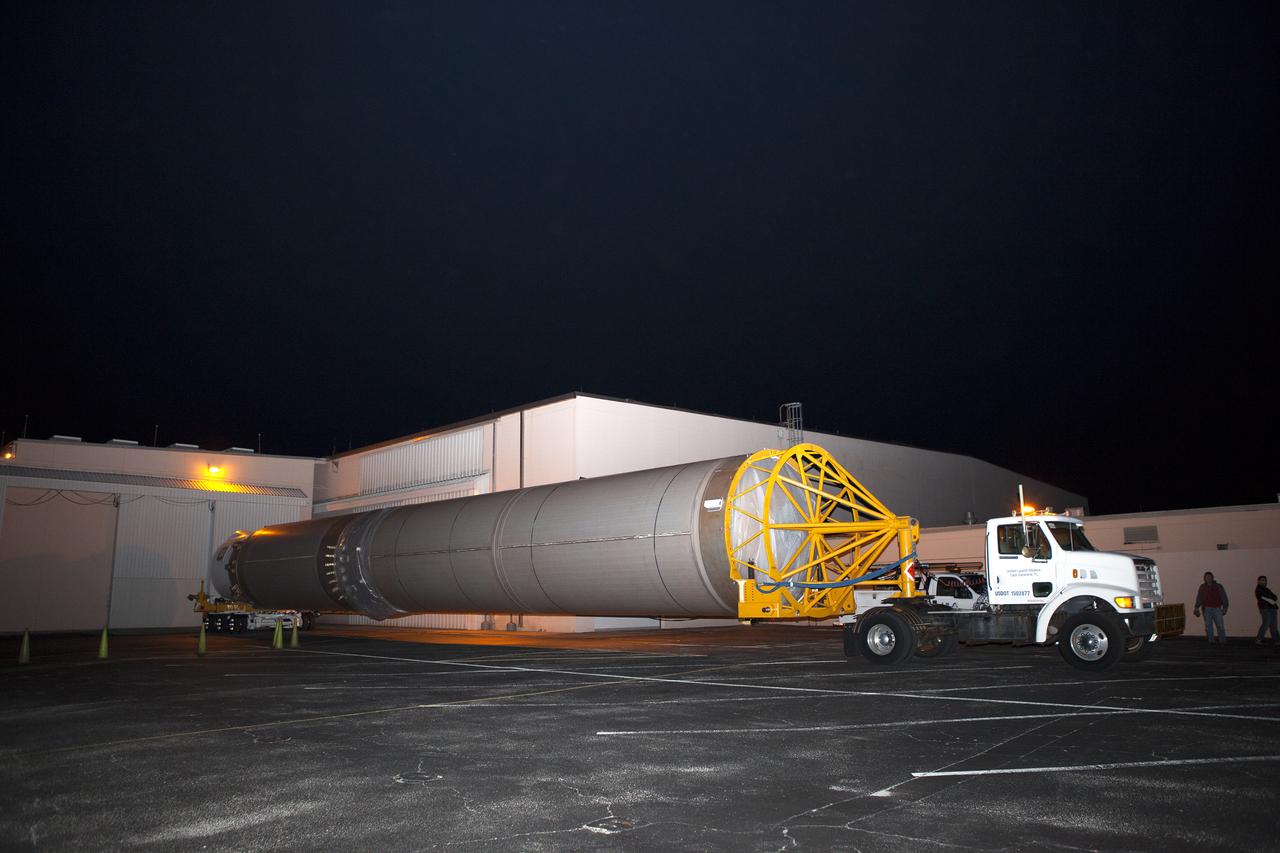 The United Launch Alliance Atlas V first stage leaves the Atlas Space Operations Center aboard a transport trailer for delivery to the Vertical Integration Facility at Space Launch Complex 41 at Cape Canaveral Air Force Station in Florida. The Geostationary Operational Environmental Satellite (GOES-R) will launch aboard the Atlas V rocket in November. GOES-R will be the first satellite in a series of next-generation NOAA GOES Satellites.