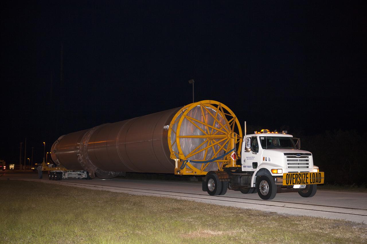 The United Launch Alliance Atlas V first stage is on its way from the Atlas Space Operations Center to the Vertical Integration Facility at Space Launch Complex 41 at Cape Canaveral Air Force Station in Florida. The Geostationary Operational Environmental Satellite (GOES-R) will launch aboard the Atlas V rocket in November. GOES-R will be the first satellite in a series of next-generation NOAA GOES Satellites. 