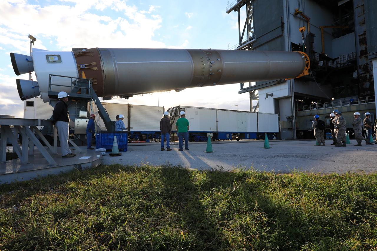 United Launch Alliance team members monitor the progress as the operation begins to lift the Atlas V first stage to the vertical position at the Vertical Integration Facility at Space Launch Complex 41 at Cape Canaveral Air Force Station in Florida. The Geostationary Operational Environmental Satellite (GOES-R) will launch aboard the Atlas V rocket in November. GOES-R will be the first satellite in a series of next-generation NOAA GOES Satellites. 