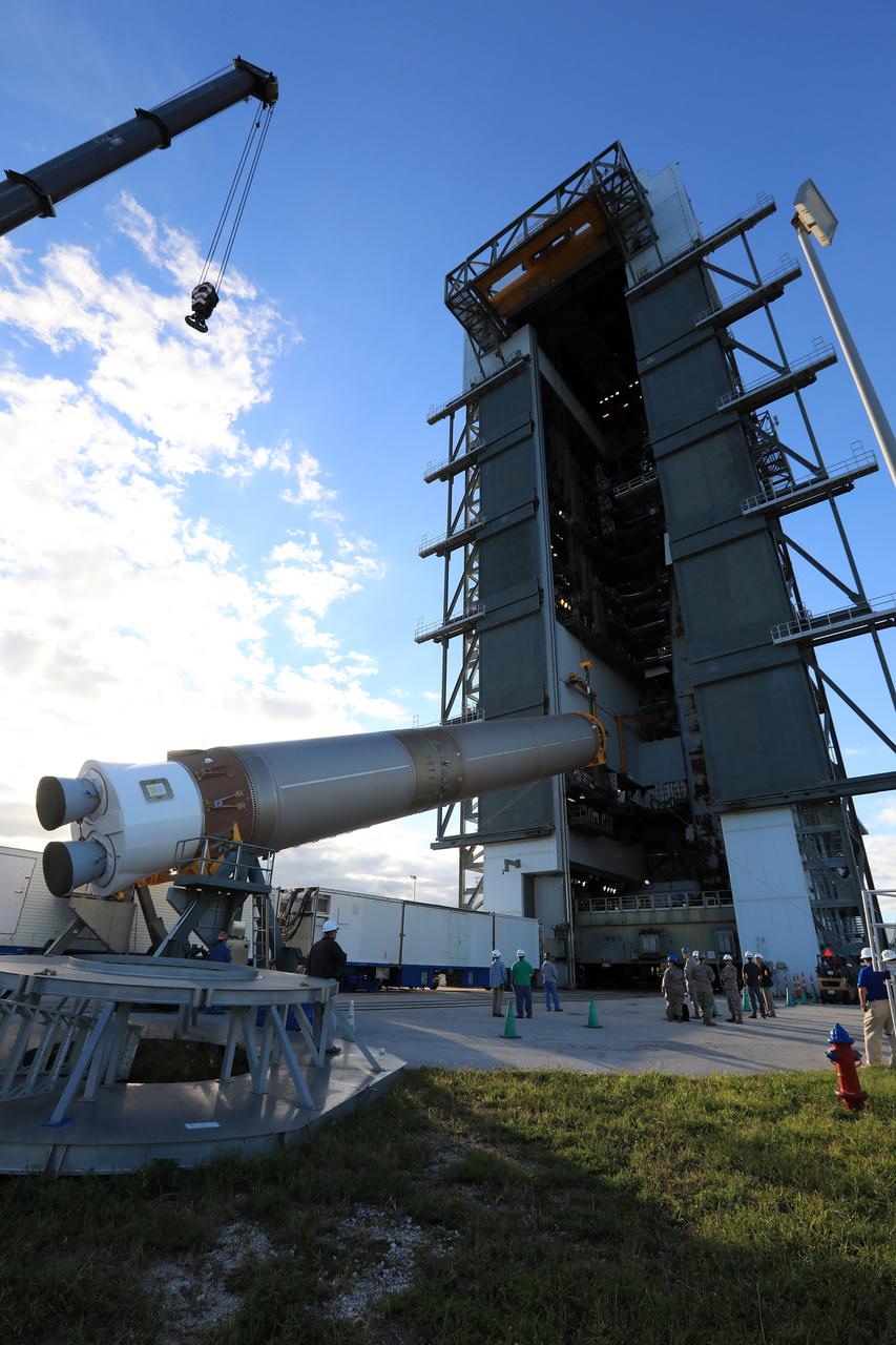 United Launch Alliance team members monitor the progress as the operation begins to lift the Atlas V first stage to the vertical position at the Vertical Integration Facility at Space Launch Complex 41 at Cape Canaveral Air Force Station in Florida. The Geostationary Operational Environmental Satellite (GOES-R) will launch aboard the Atlas V rocket in November. GOES-R will be the first satellite in a series of next-generation NOAA GOES Satellites.