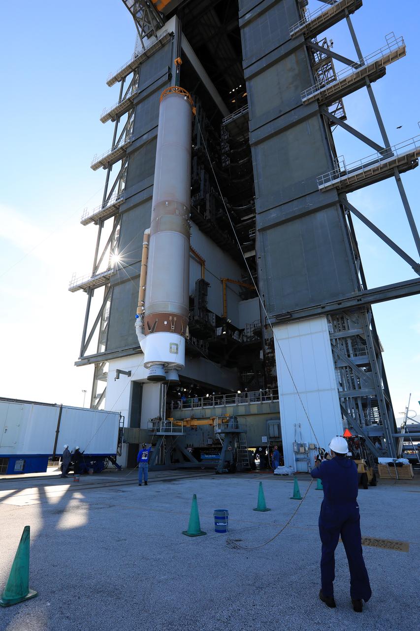 The United Launch Alliance Atlas V first stage is lifted to the vertical position in the Vertical Integration Facility at Space Launch Complex 41 at Cape Canaveral Air Force Station in Florida. The Geostationary Operational Environmental Satellite (GOES-R) will launch aboard the Atlas V rocket in November. GOES-R will be the first satellite in a series of next-generation NOAA GOES Satellites.