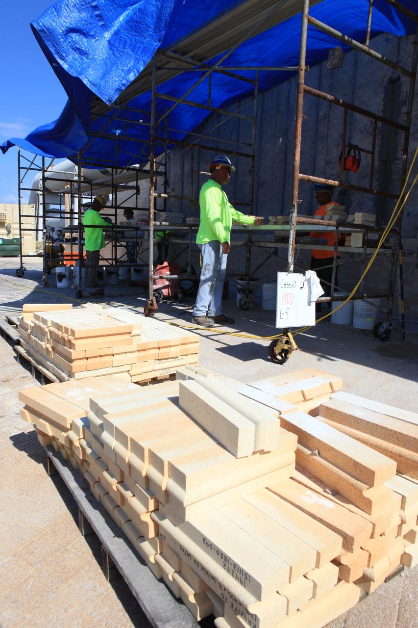 Progress continues on the new flame trench at Launch Pad 39B at NASA's Kennedy Space Center in Florida. Construction workers with J.P. Donovan of Rockledge, Florida, prepare new heat-resistant bricks for installation on the north side of the flame trench. The Pad B flame trench is being refurbished to support the launch of NASA’s Space Launch System rocket. The Ground Systems Development and Operations (GSDO) Program at Kennedy is helping transform the space center into a multi-user spaceport and prepare for Exploration Mission 1, deep space missions, and NASA's Journey to Mars. For more information about GSDO, visit: http://www.nasa.gov/groundsystems.